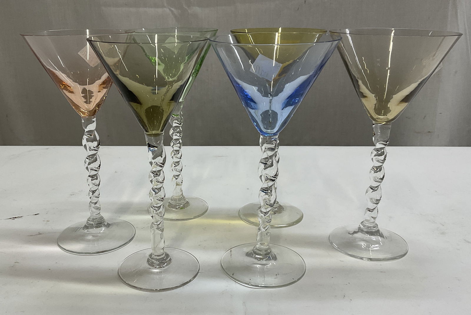 Set 6 Colorful Martini Glasses Stemware: Set 6 Colorful Twist Stemware Cocktail Glasses. Each measures app 7in x 3.5 diameter. Minor rim chip on blue. Stemware, barware, colorful glasses, assorted glasses, tableware, home decor, table decor,