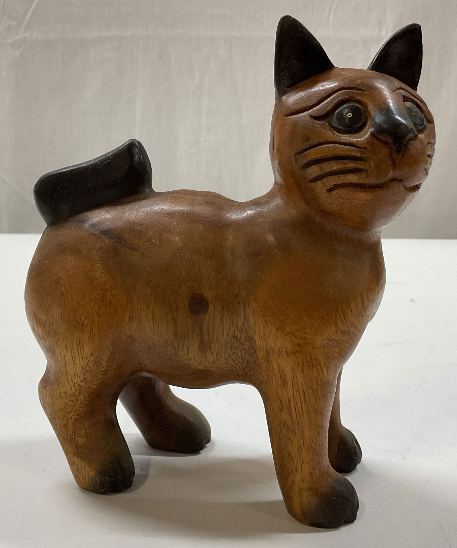 Vtg Hand Carved Wooden Cat Figure: Vintage hand carved wooden cat figure. No visible markings. Cat figure in standing pose with head slightly turned. Hand carved details and features. Measures approx 3 x 5 x 7.5 inches. Surface