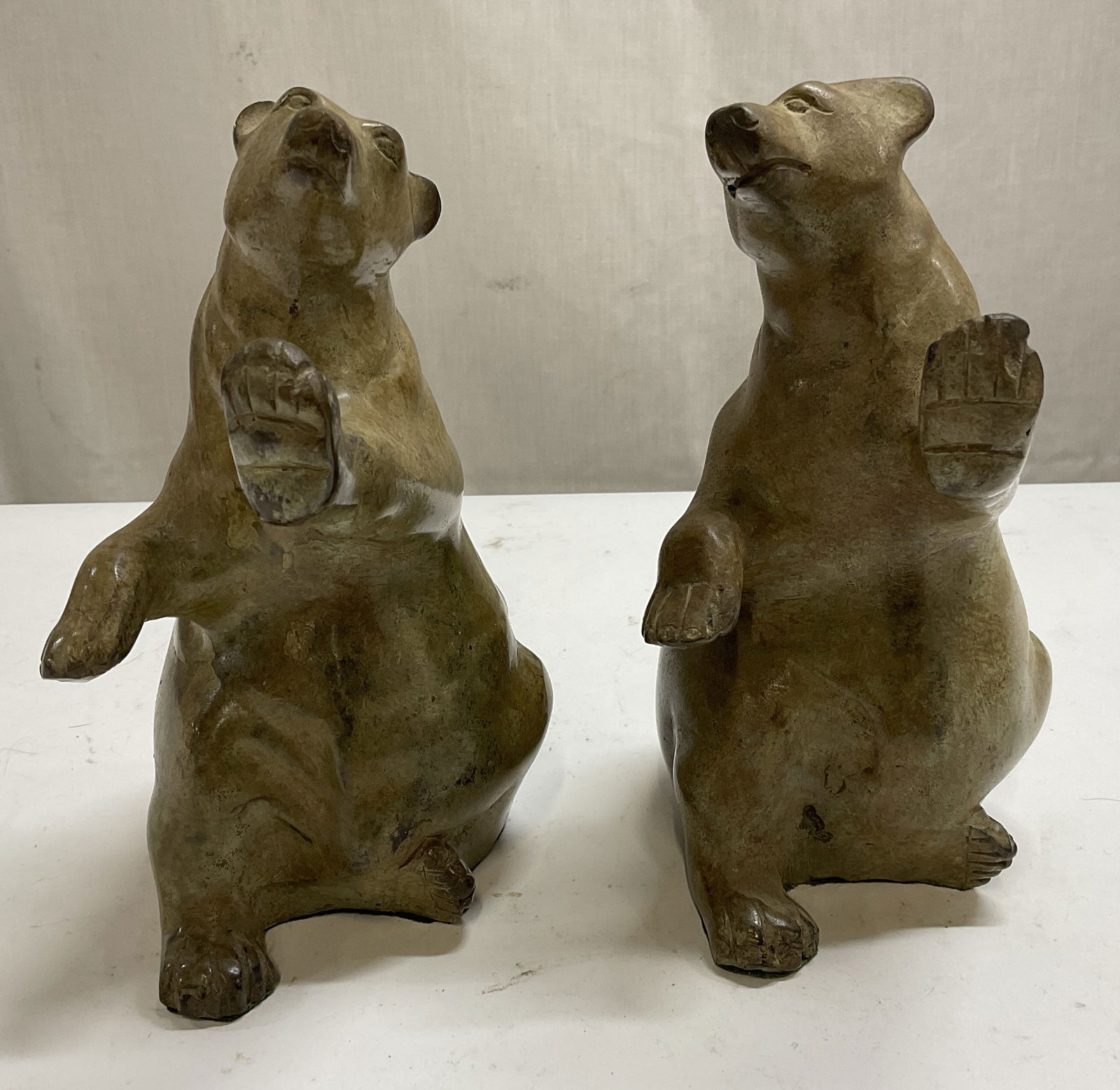 Pair Cast Iron Bear Bookends: Cast Iron Bear Bookends. Patina Finish. Some scratches. Measure approximately 7in H x 3in L. home decor, table decor, decor, home accessories, collectibles. 8 CS