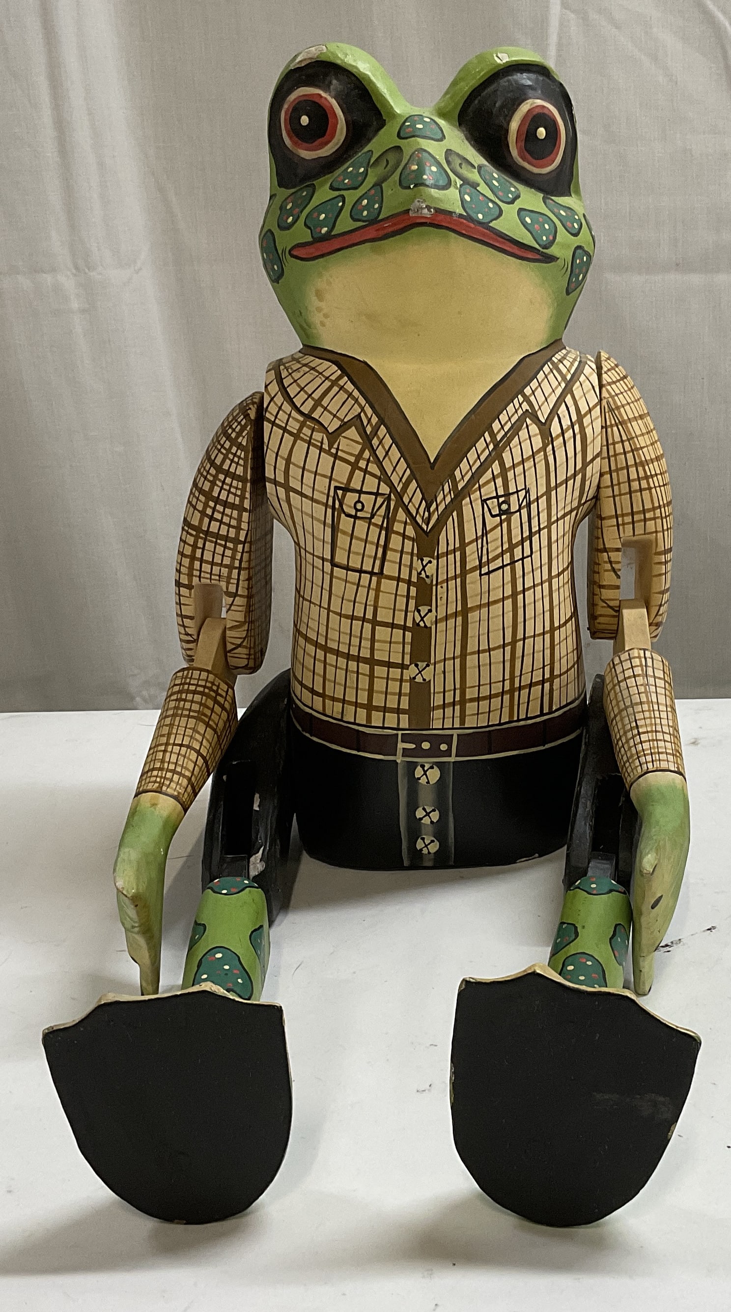 Hand Carved and Painted Wooden Frog Puppet: Hand Carved and Painted Wooden Frog Puppet. Dressed in brown flannel and pants. Some chips in paint. Posable joints. App 20.5in H x 7in W. home decor, table decor, decor, home accessories,