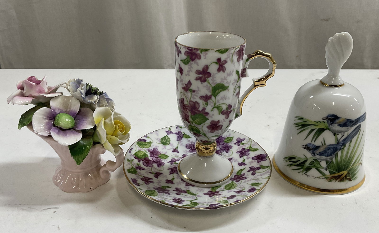 Lt 4 Colorful China: Radnor, Roger Tory Peterson+: Lt of 4 Pieces of colorful China. Features a hand-made vase of flowers marked Radnor Bone China Staffordshire England, a gold-trimmed bell marked The Songbird Collection by Roger Tory Peterson Scrub J