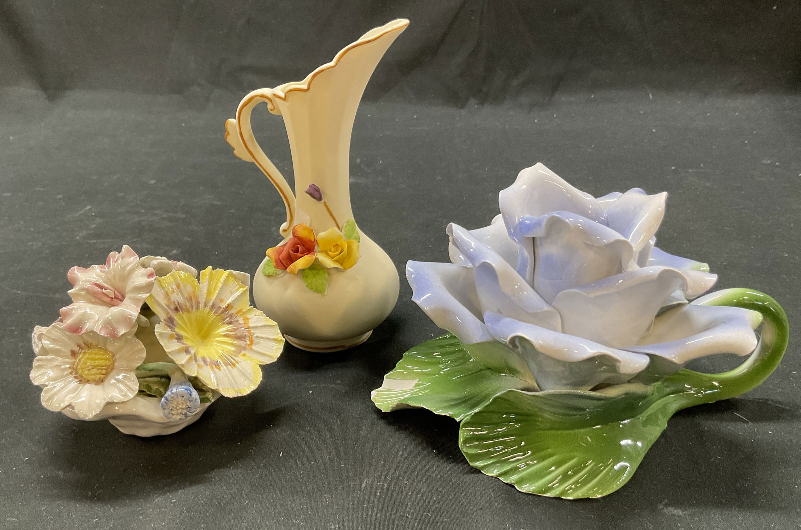 Lot 3 Capodimonte+ Floral Tableware Italy: Lot of 3 items. Capodimonte bisque porcelain floral creamer pitcher, marked on underside. Lord + Taylor porcelain floral candle holder, marked on underside, made in Italy. Porcelain floral bouquet fig