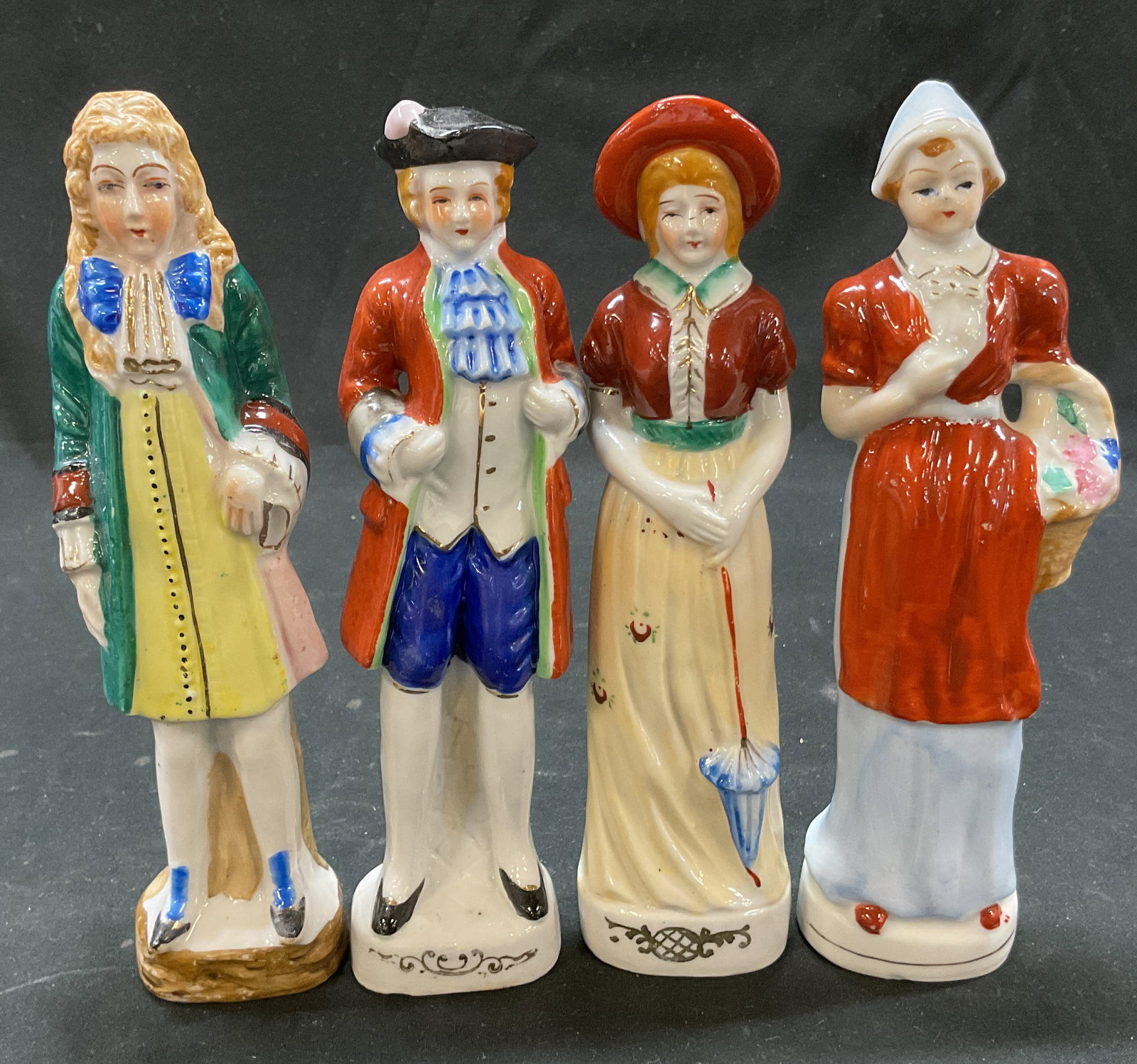 Lot 4 1940s-50s Vintage Porcelain Figures Japan: Lot of 4 vintage porcelain figures. Marked on underside, made in Occupied Japan. Female and male figures. Produced around 1940s to 1950s. Hand painted features and details. Varying colors. Victorian s