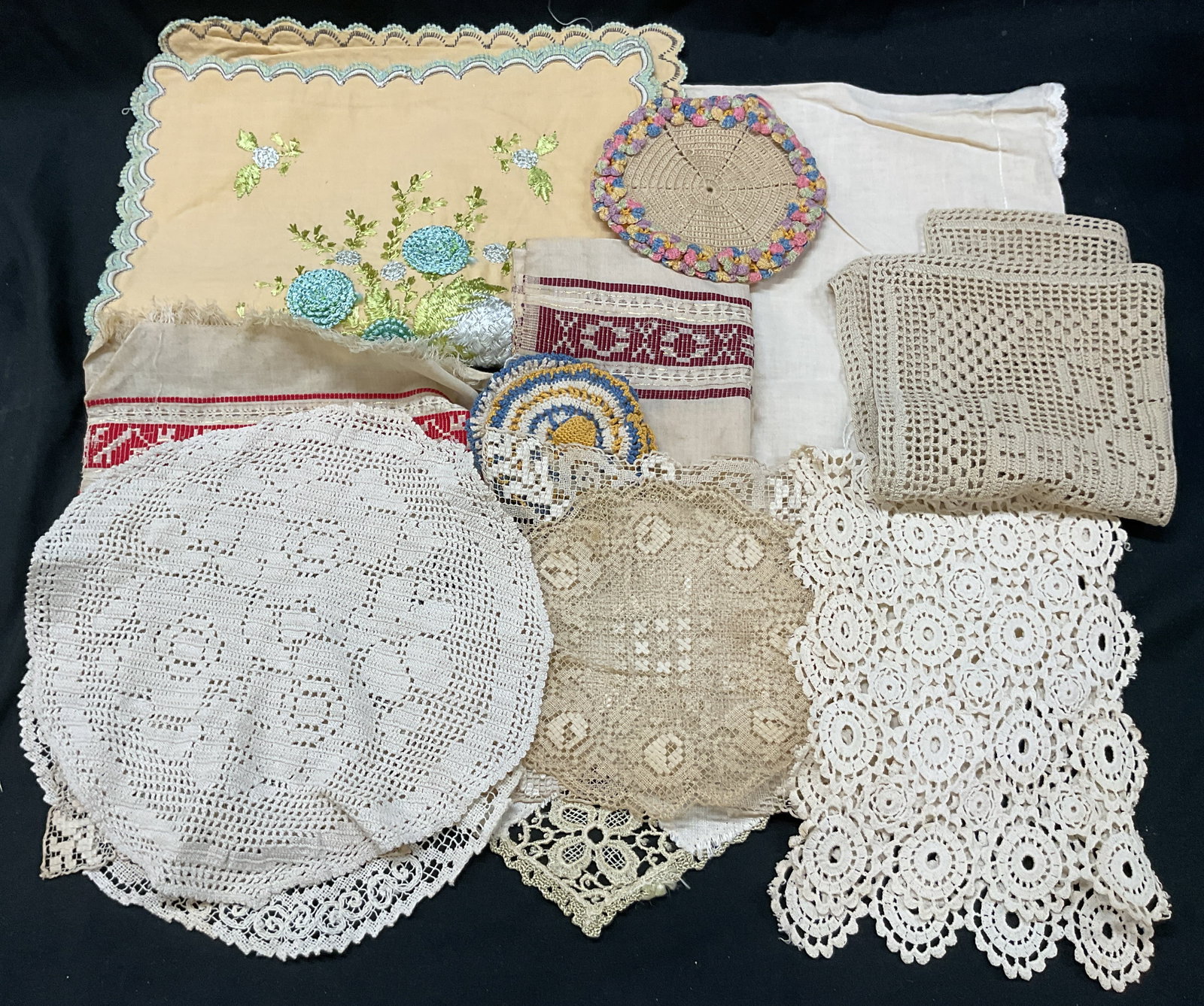 Grp Lot 15 Vintage Embroidered Linens: Group lot of 15 vintage embroidered linens. Includes 2 pillowcases, 1 napkin, 1 coaster, 8 doilies, 1 table runner, and 2 miscellaneous linens. Linen and lace material. Embroidered floral and scroll m
