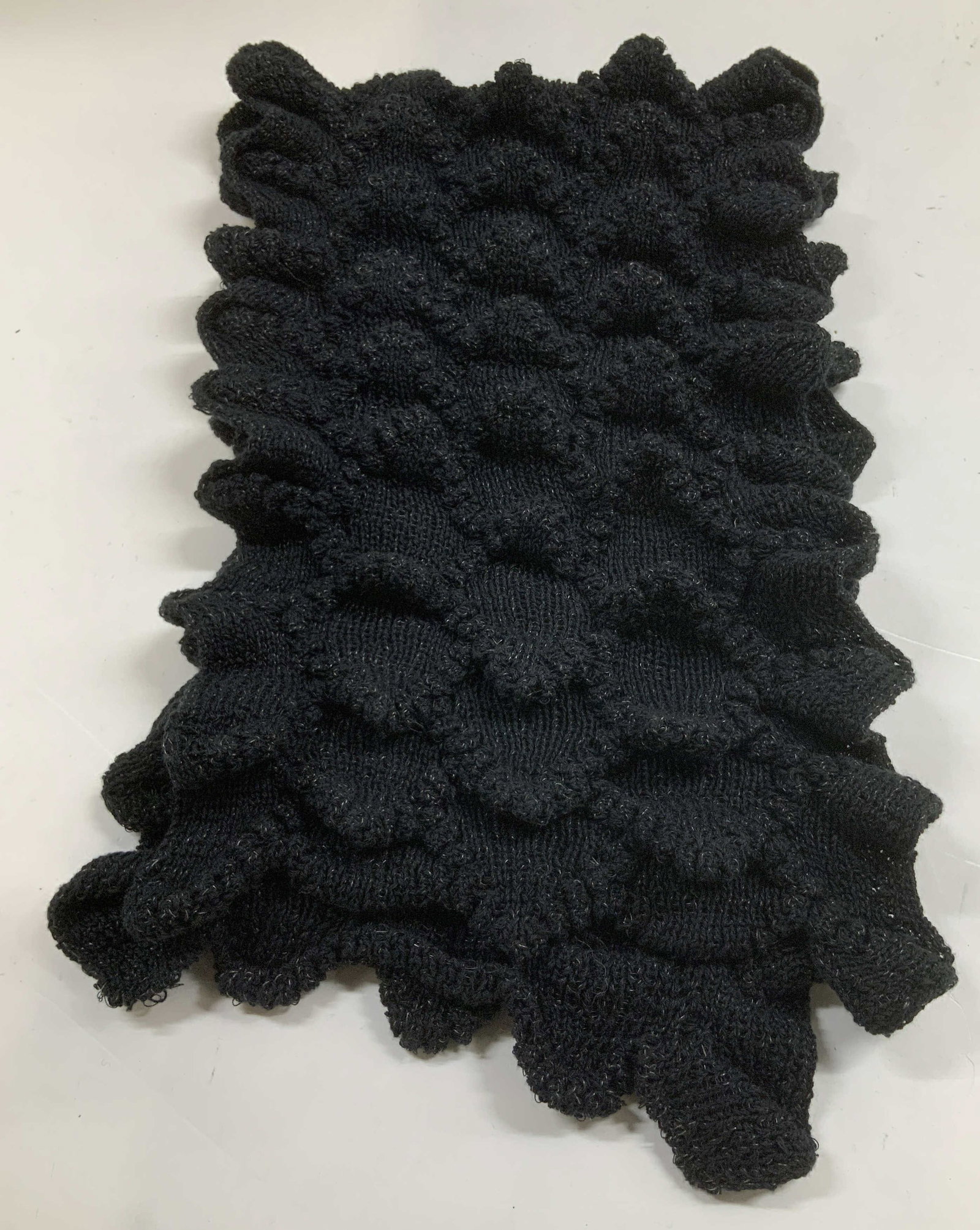 Vtg Smartworks Inc Black Ruffled Scarf USA: Vintage Smartworks scarf features a textured ruffled pattern. Black toned. Knitted. Sonya Mackintosh Design. Sold as is. Signed & marked. Reads, SMARTWORKS INC. MADE IN USA. Surface wear consistent to
