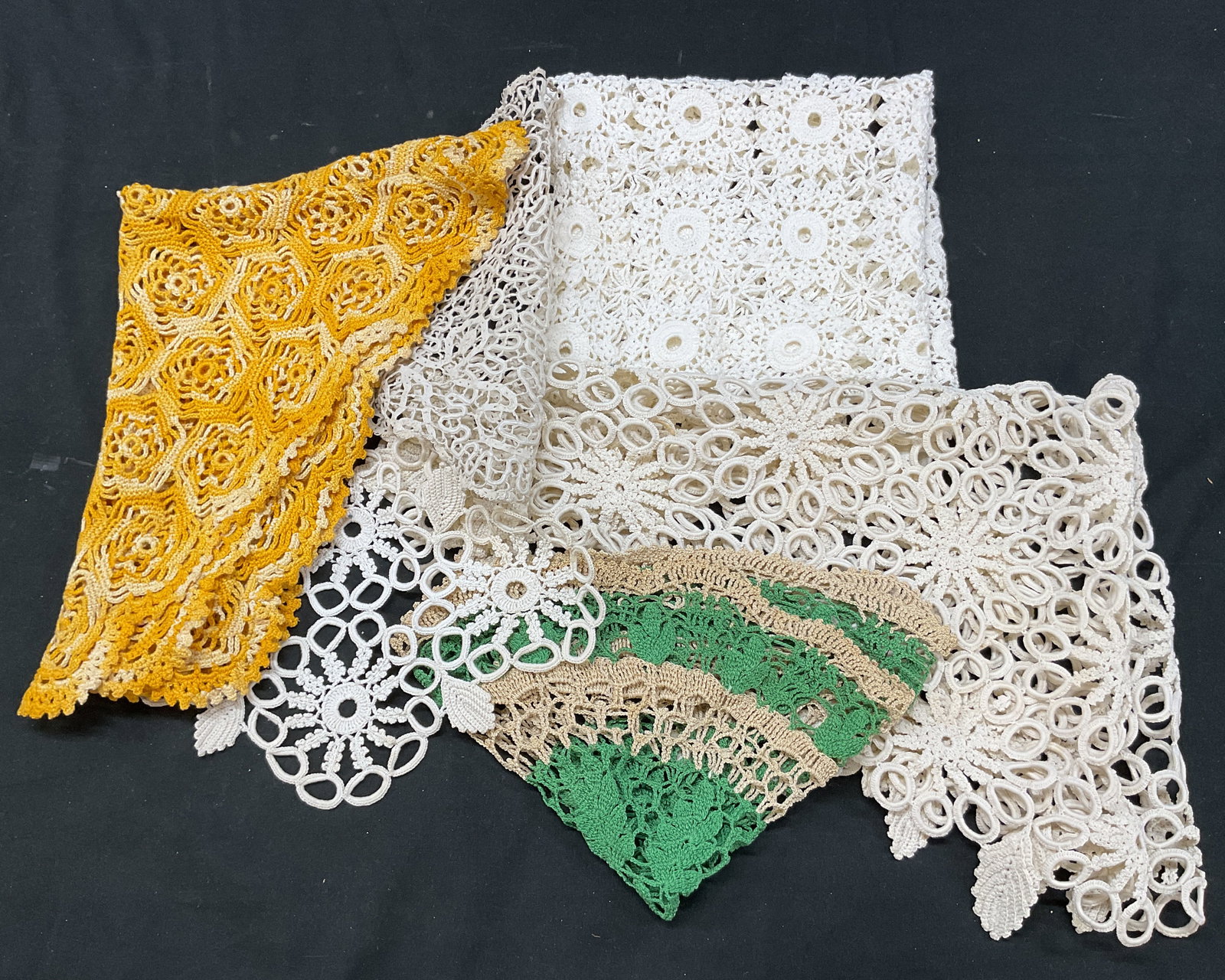 Grp Lot 6 Vintage Embroidered Doilies: Group lot of 6 vintage embroidered white doilies. Lace material. Embroidered floral motifs. Intricate cut out patterns. Shapes, color, size vary. Largest measures approx 21 x 33 inches. Blemishes and