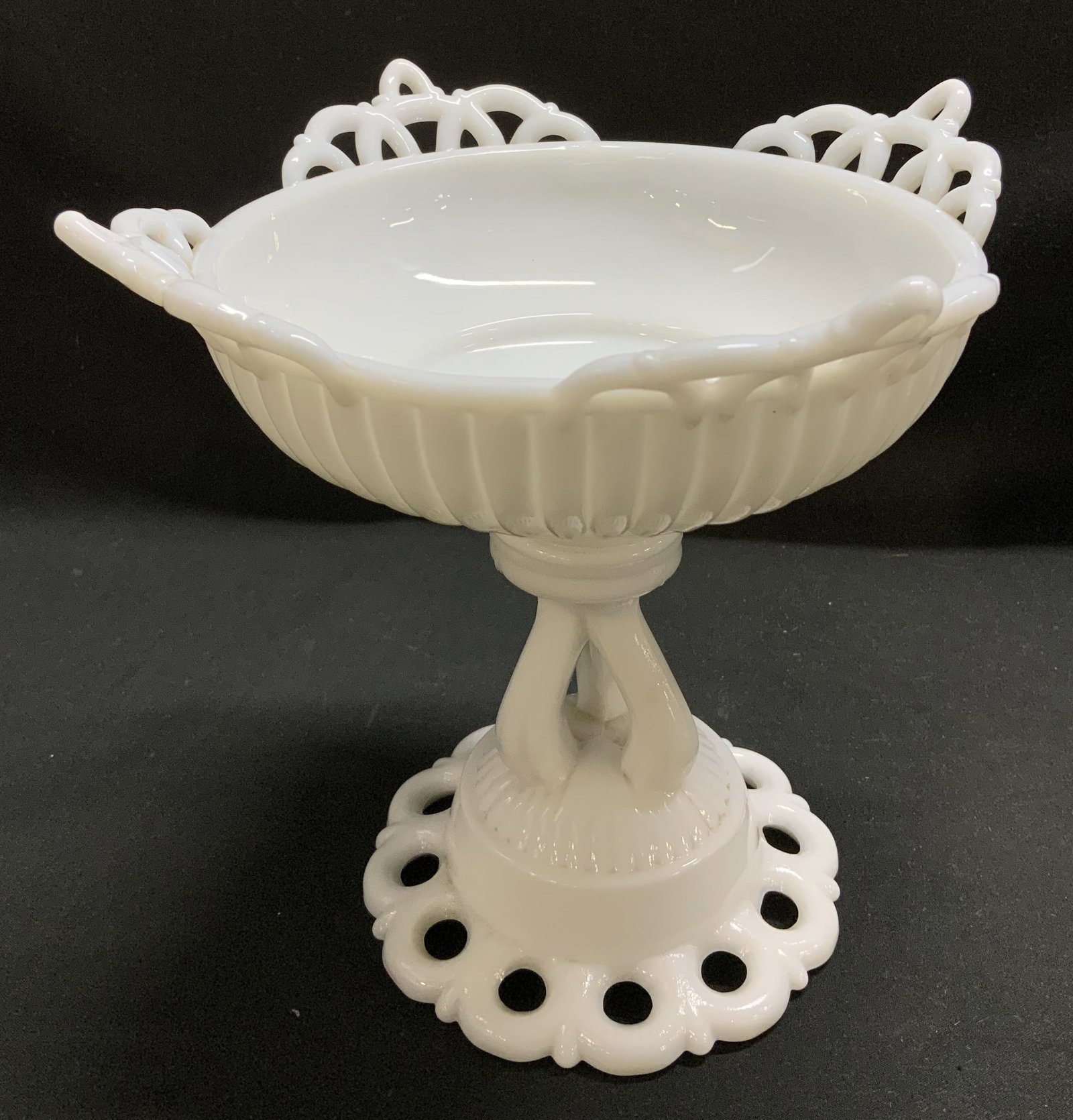 Vtg Westmoreland Milk Glass Doric Compote: Vintage Westmoreland milk glass compote features a Doric pattern. Lace edge & pedestal base. Top of compote has a distinctive design. Signed & marked on underside. Visible W. Westmoreland. Surface wea