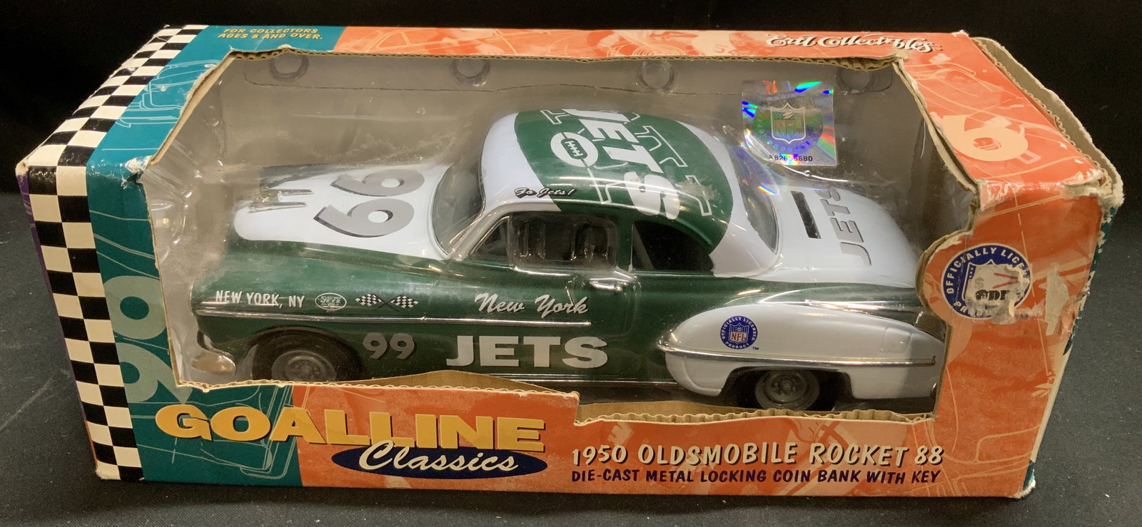 1999 Ertl 1950 Oldsmobile Rckt 88 DieCast Coin Bnk: 1999 Ertl Collectibles NFL 1950 Oldsmobile Rocket 88 die-cast metal locking coin bank with key, in the New York Jets color scheme. Green & white toned. Comes with original box. Surface wear consistent