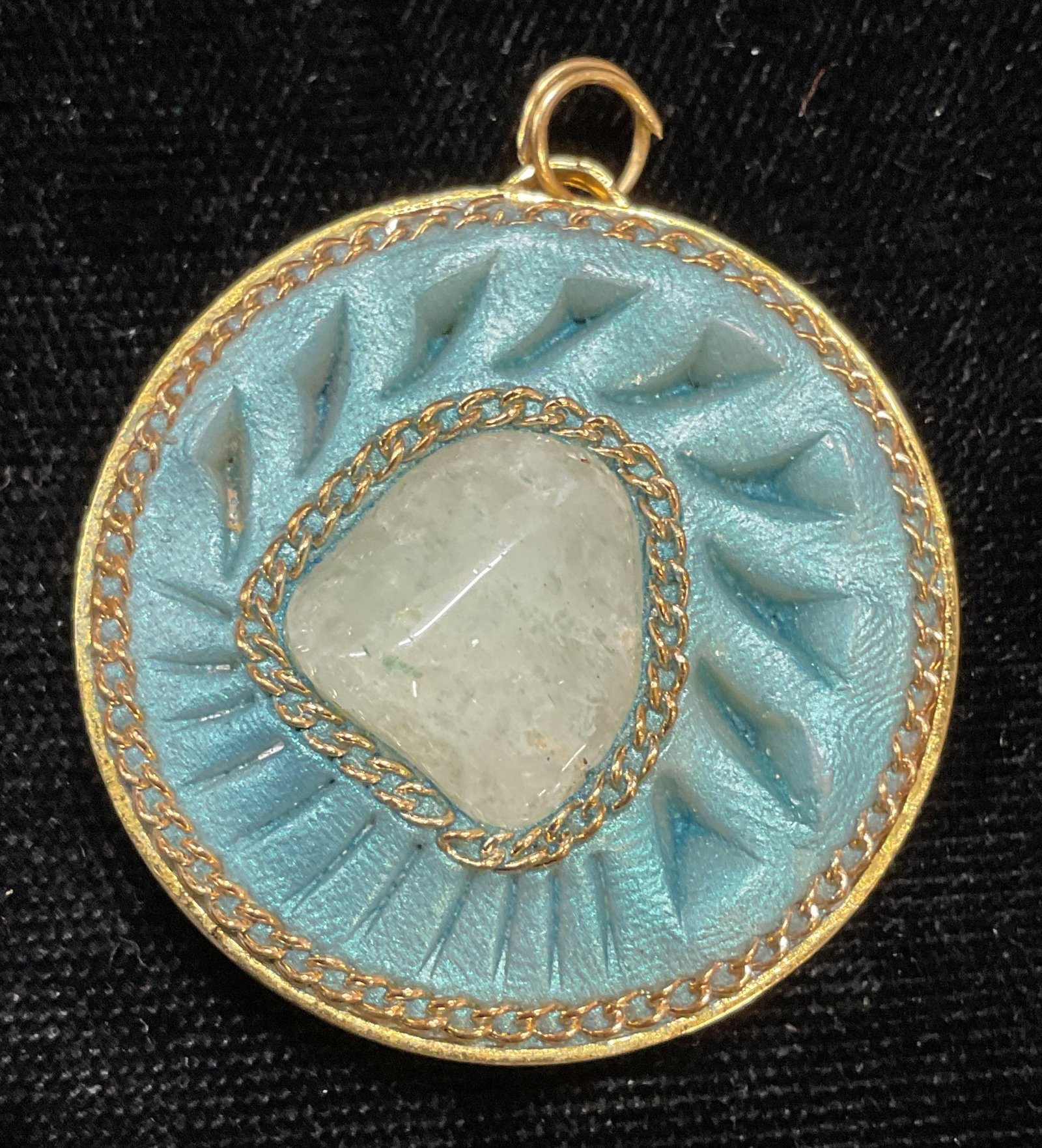 Gold Tone Blue Semiprecious Pendant: Gold tone pendant with iridescent blue and semiprecious stone decoration. Measures approx 1.25 inches wide. Some scratching. Jewelry, estate jewelry, costume jewelry, cocktail jewelry, fashion jewelry