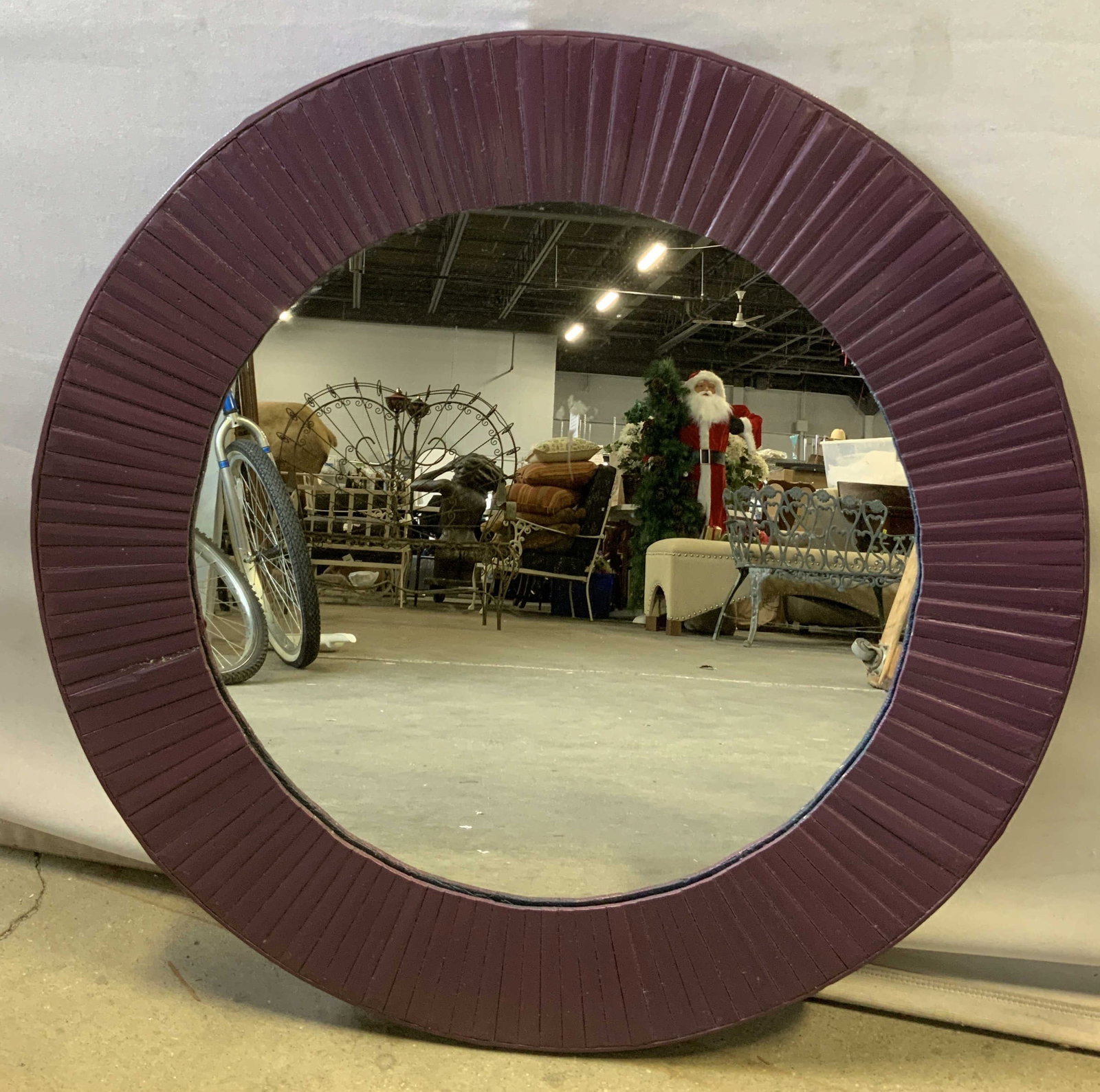 Wooden Round Wall Mirror 25.2in: Decorative round wall mirror featuring vertical rubbing. Purple toned. Hooks on back. No visible signature or markings. Surface wear consistent to age, use & exposure. Measurements: width 25.2in x hei
