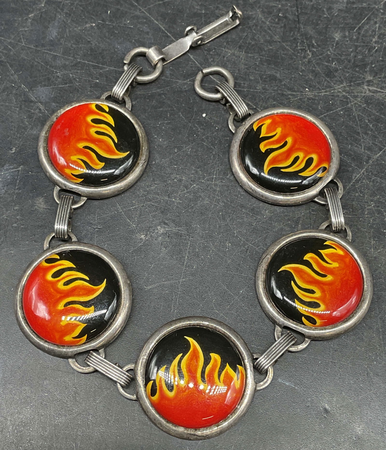 Silver Tone Flame Panel Bracelet: Silver tone bracelet with flame motif panels. Measures approx. 7 inches long. Some scratching. Jewelry, estate jewelry, costume jewelry, cocktail jewelry, fashion jewelry, accessories, fashion accesso