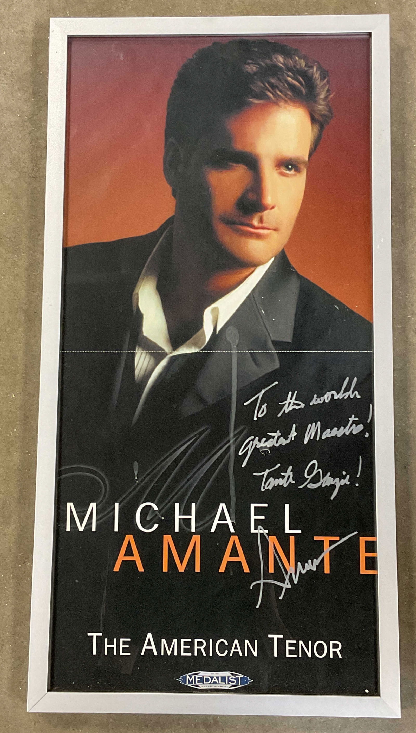 Framed Signed Michael Amante Opera Tenor Litho 24i: Framed lithograph poster. Michael Amante, The Mexican Tenor. Opera. Signed and inscribed lower right by Michael Amante. Silver tone frame. Not examined out of frame. Frame measures approx. 24.25 x 12.