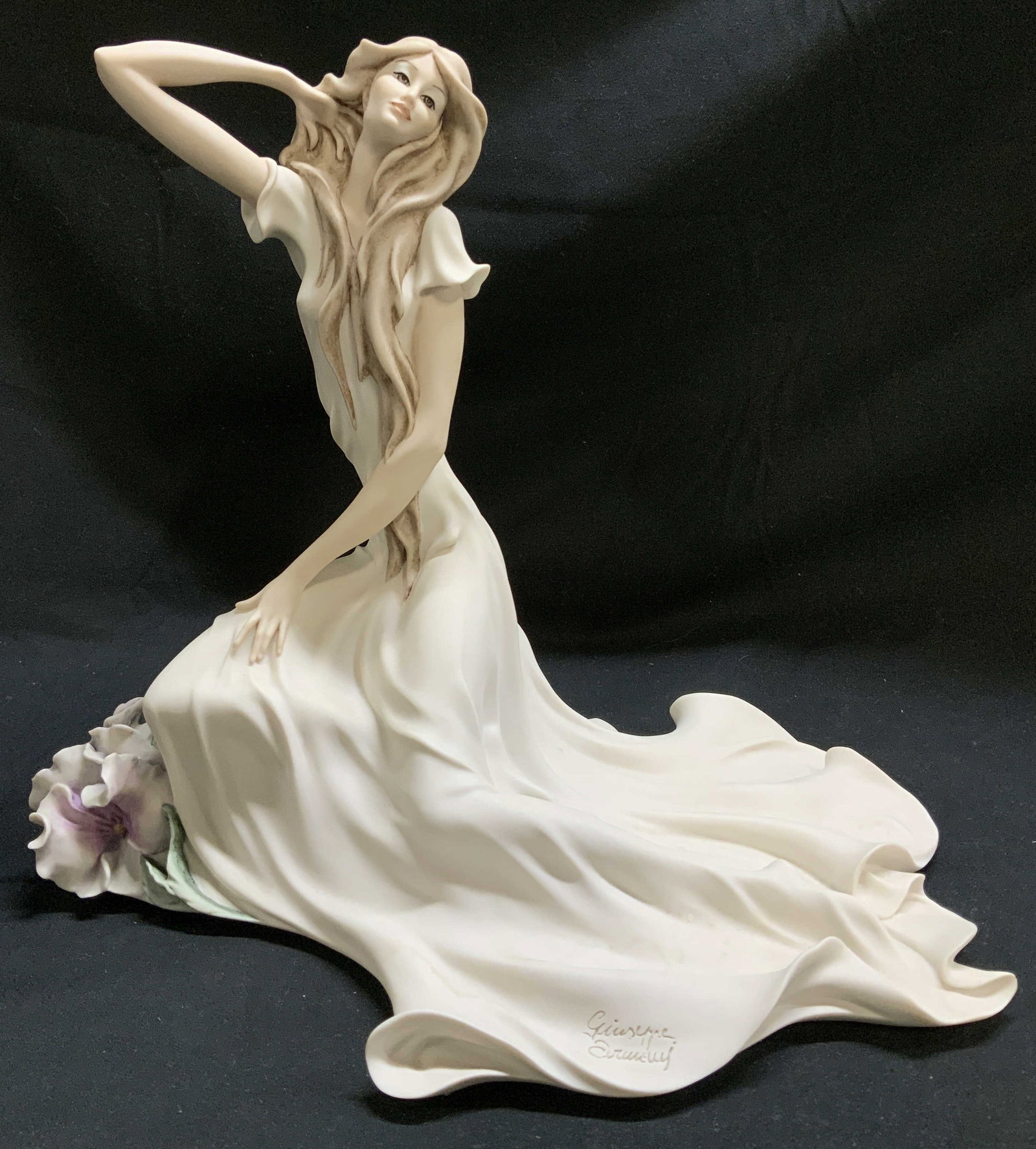 2003 Florence Giuseppe Armani Woman Fig ITALY: Florence Giuseppe Armani figurine depicting a woman in a flowing white gown sitting beside a flower. Porcelain material. Signed & marked on underside. Reads, 2003 FLORENCE GIUSEPPE ARMANI. MADE IN ITA