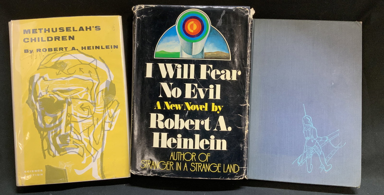Lot 3 Science Fiction Novels 1940&1970s HEINLEIN: Lot includes, Methuselahs Children by Robert A. Heinlein (1941), Space Cadet by Robert A. Heinlein (1948), I Will Fear No Evil by Robert A. Heinlein (1970). Science Fiction. Sold as is. Surface wear c