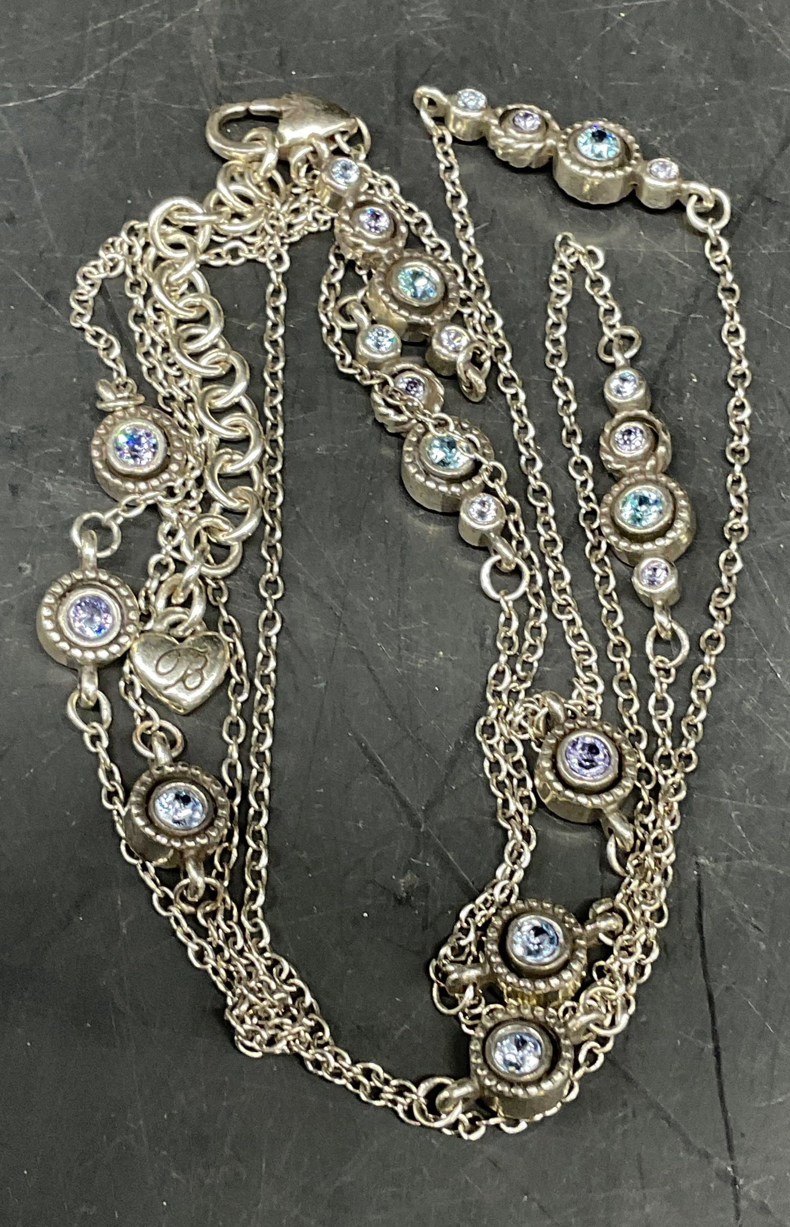 Brighton Silver Tone Blue Crystal Necklace: Signed Brighton silver tone necklace with blue crystals. Drop length measures approx. 20 inches. Chain needs untangling. Some scratching. Jewelry, estate jewelry, costume jewelry, cocktail jewelry, fa