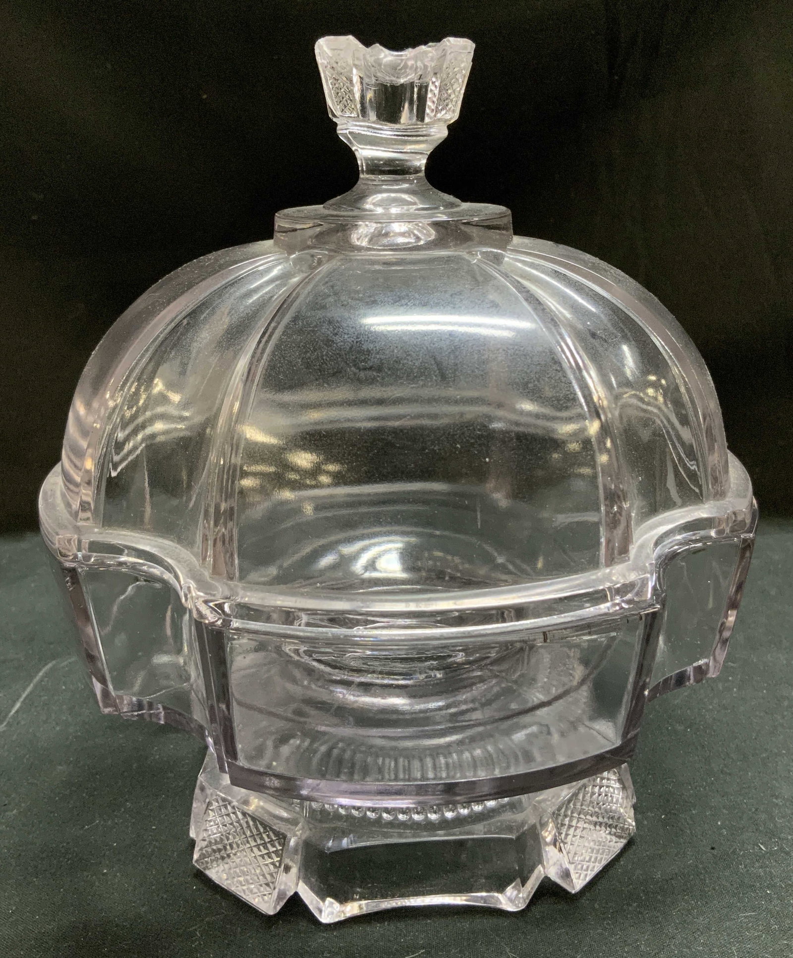Vtg Lilac Toned Glass Pedestal Compote Bowl: Compote bowl is footed & is made of lilac toned glass. Features a round domed lid & waffle like texture on base. Ornate finial on lid. Lilac toned. Surface wear consistent to age, use & exposure. Meas