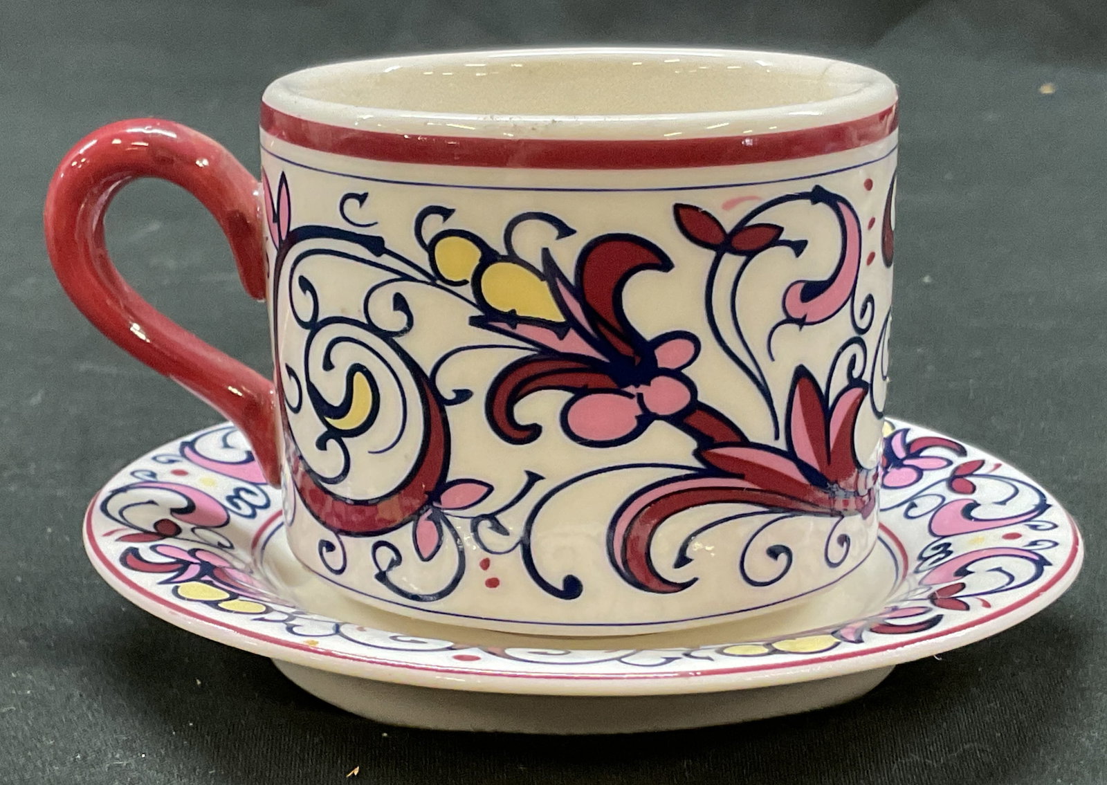 Lot 2 White Barn Ceramic Espresso Cup & Saucer: Lot of 2 items. White Barn ceramic espresso cup and saucer. Marked on underside, reads The White Barn Candle Co. Hand painted floral motifs in varying colors. Cup measures approx 2.5 x 3.5 x 2 inches.