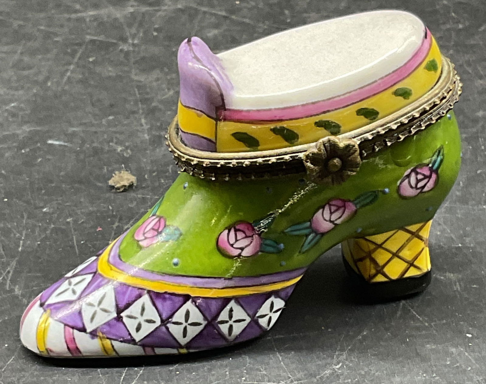CBK Porcelain Victorian Shoe Trinket Box: Signed CBK Ltd porcelain Victorian shoe motif trinket box. Hand painted. Measures approx. 3 x 1 x 1.75 inches. Some scratching and small chip. CBK trinket box, shoe trinket box, porcelain trinket box,