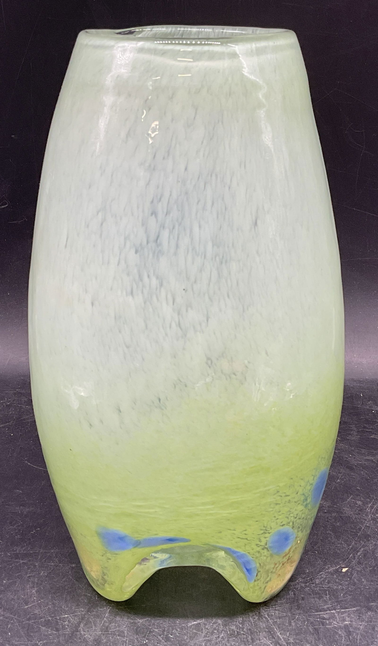 Mottled Green Art Glass Footed Vase: Mottled green art glass vase with blue accents and footed base. Measures approx. 4.5 x 9 inches. Some scratching. Art glass vase, green vase, home decor, home accessories, table decor, table accessori