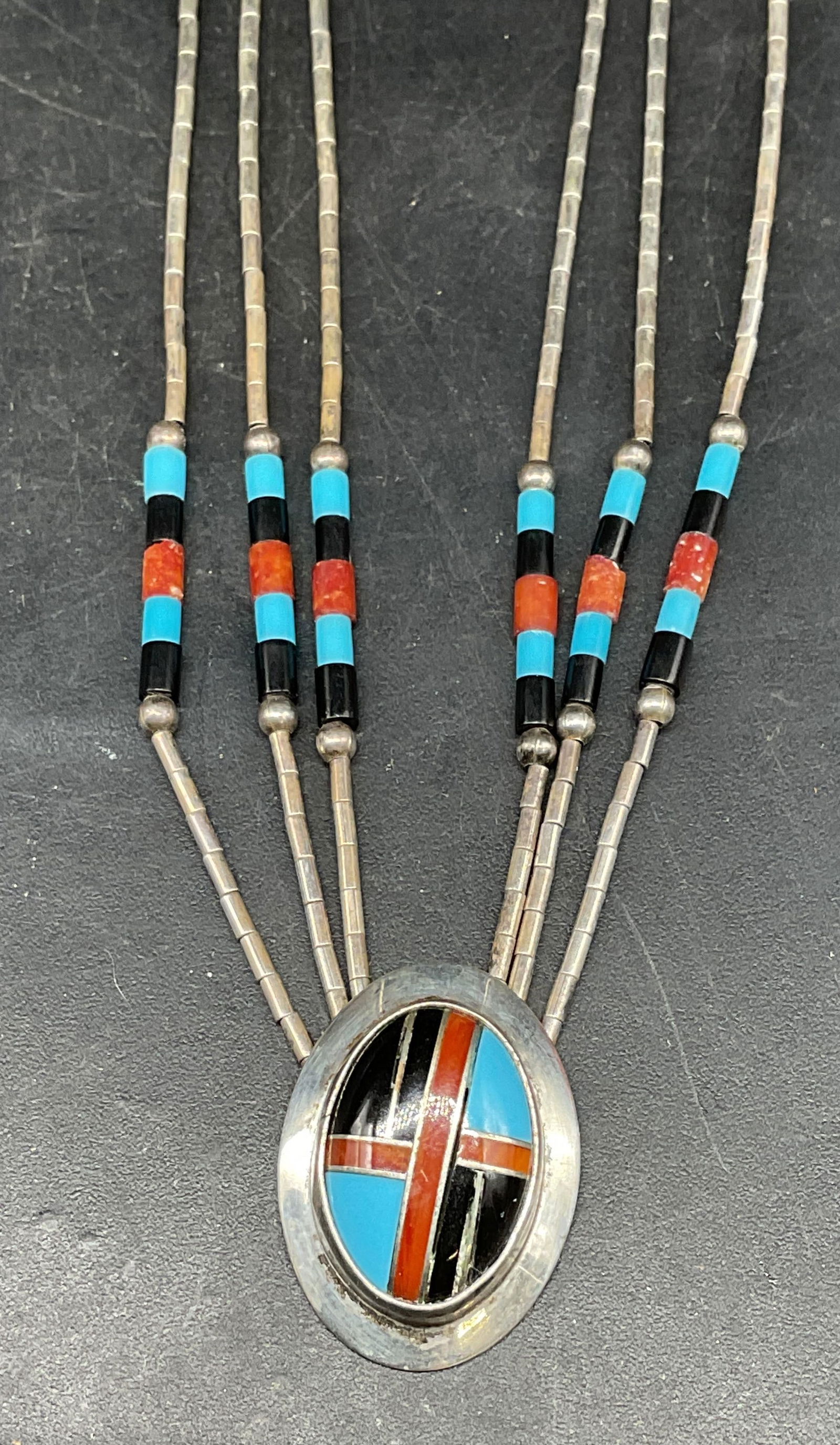 Sterling Silver Turquoise Coral Pendant Necklace: Vintage sterling silver necklace turquoise, coral, and possibly jet beads. Inlaid turquoise, coral, and possibly jet pendant. Drop length approx. 10 inches. Total weight 10.3 grams. Some scratching. J