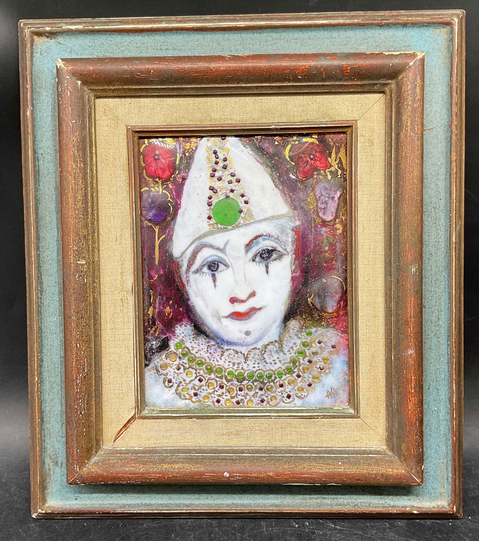 Framed Signed Mixed Media Clown Portrait: Framed mixed media artwork. Signed lower right illegibly. Portrait of a clown. Appears to be glass with gilt and pigments. Gilt and blue wood frame. Not examined out of frame. Frame measures approx. 1