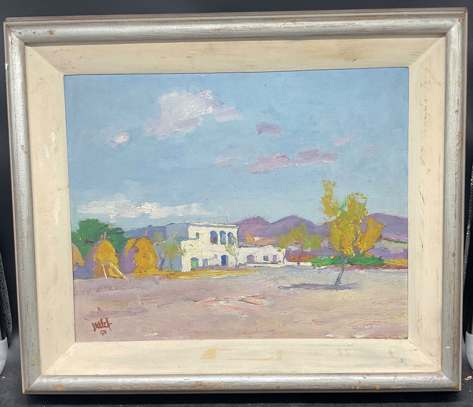 Signed Mid Cen Haystacks Landscape Oil Painting: Framed oil on board painting. Signed illegibly at lower left, dated 1950. Landscape with haystacks and building. Silver tone wood frame. Not examined out of frame. Frame measures approx 17.5in by 20.7