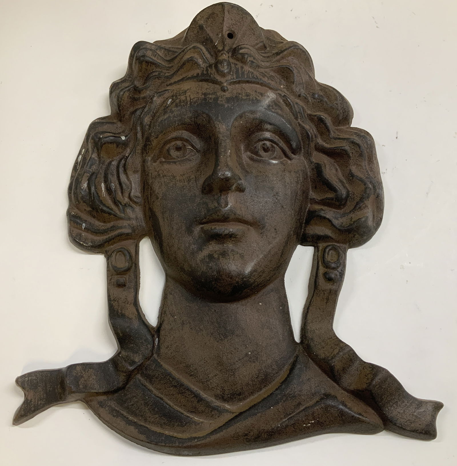 Vtg Cast Iron Female Bust Wall Plaque: Vintage cast iron plaque depicting a female bust. Female has flowing hair & ribbon accents. Plaque has some weight. No visible signature or markings. Surface wear consistent to age, use & exposure. Me