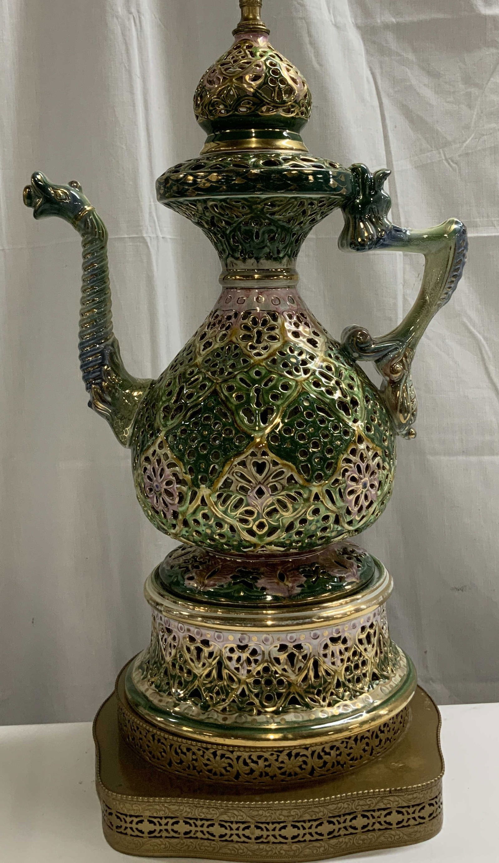 Vtg Hand Painted Ewer Table Lamp 29.5in: Vintage table lamp features en ewer form with a curved spout & handle. Features pierced filigree & hand painted accents. Shades of green, blue, pink. Stands on a brass toned base. Glossy finish. No vi