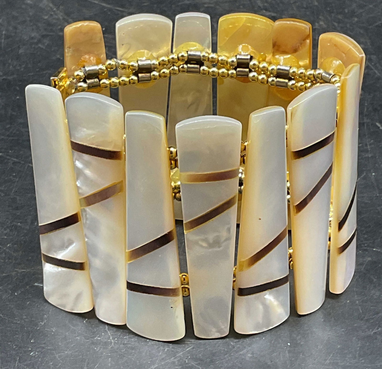 Vtg William DeLillo Mother of Pearl Bracelet: Vintage signed William DeLillo bracelet with mother of pearl panels and geometric design. Measures approx. 6.5 inches long, 2,25 inches wide. Some scratching. Jewelry, estate jewelry, fine jewelry, co