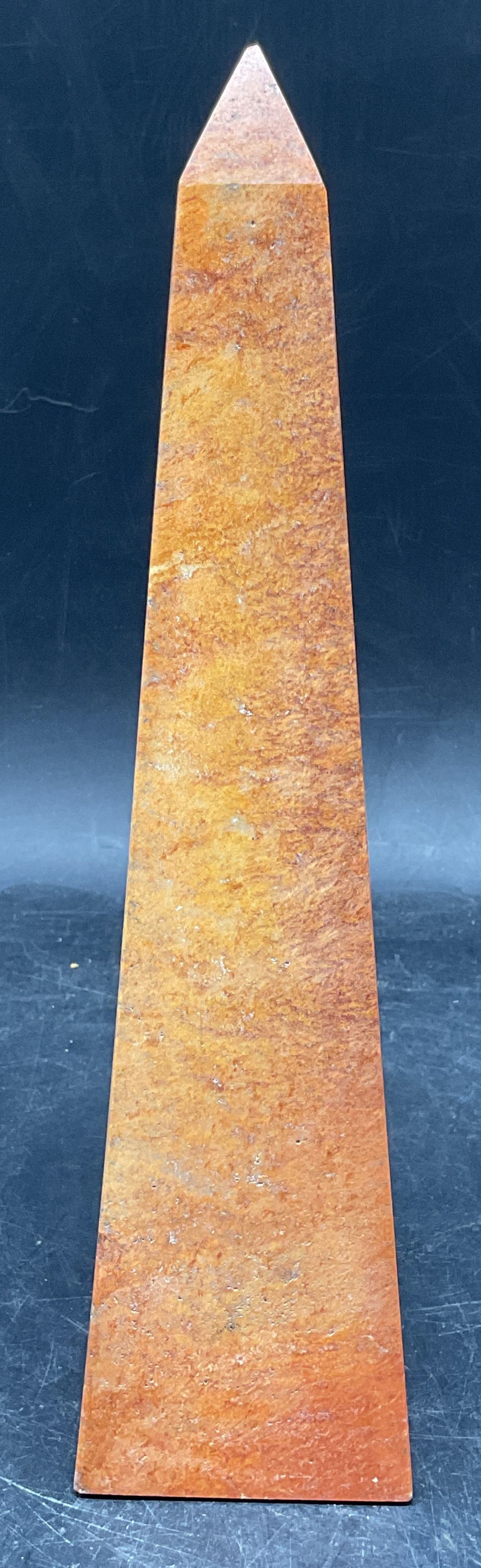 Carved Orange Stone Obelisk Tower: Carved orange natural stone obelisk tower. Measures approx. 2.5 x 2.5 x 10 inches. Wear including small chips and scratching. Stone obelisk, stone tower, collectibles, home decor, home