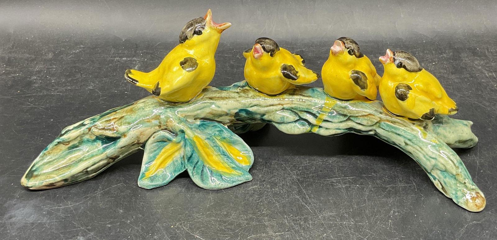 Vintage Stangl Pottery Goldfinch Figurine: Vintage Stangl pottery goldfinch figurine. Birds perched on branch. Hand painted. Marked EJ on underside. Measures approx. 12 x 4.5 x 4.25 inches. Wear including small chips, scratching, crazing. Stan