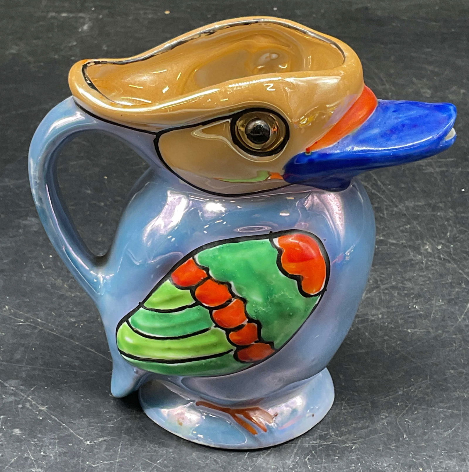 Vintage Luster Ceramic Duck Creamer, Japan: Vintage luster ceramic duck bird motif creamer. Hand painted blue and orange. Made in Japan. Measures approx. 4.5 x 2.5 x 4.25 inches. Some scratching. Luster creamer, duck creamer, bird creamer, coll