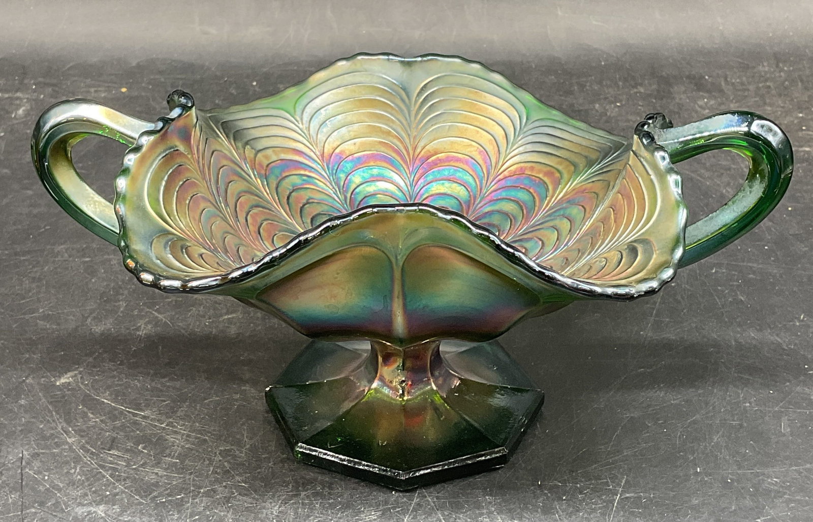Vtg Green Carnival Glass Peacock Tail Bowl: Vintage Fenton style green carnival glass pedestal Bon bon bowl. Peacock tail pattern. No signature or markings. Measures approx. 8.25 x 5.75 x 4.75 inches. Some scratching. Carnival glass bowl, peaco