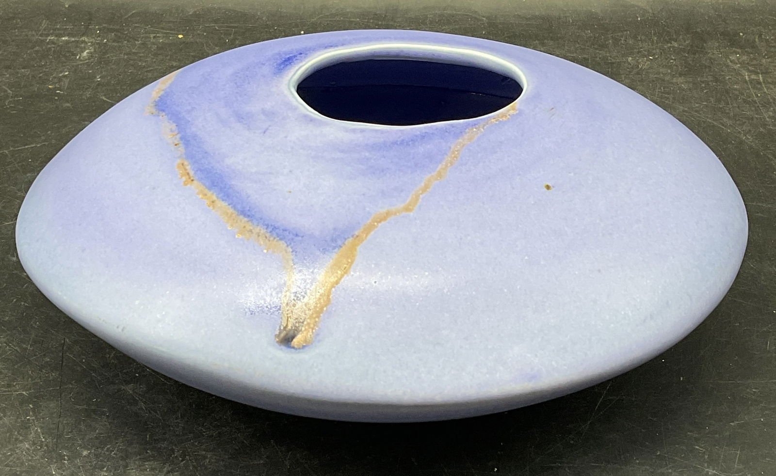 Signed Asian Purple Drip Disc Ceramic Vase: Signed Asian ceramic vase. Disc shaped with purple drip glaze. Signed with stamp on underside, Asian characters. Measures approx. 8.5 x 3.5 inches. Some scratching. Asian vase, purple vase, drip vase,