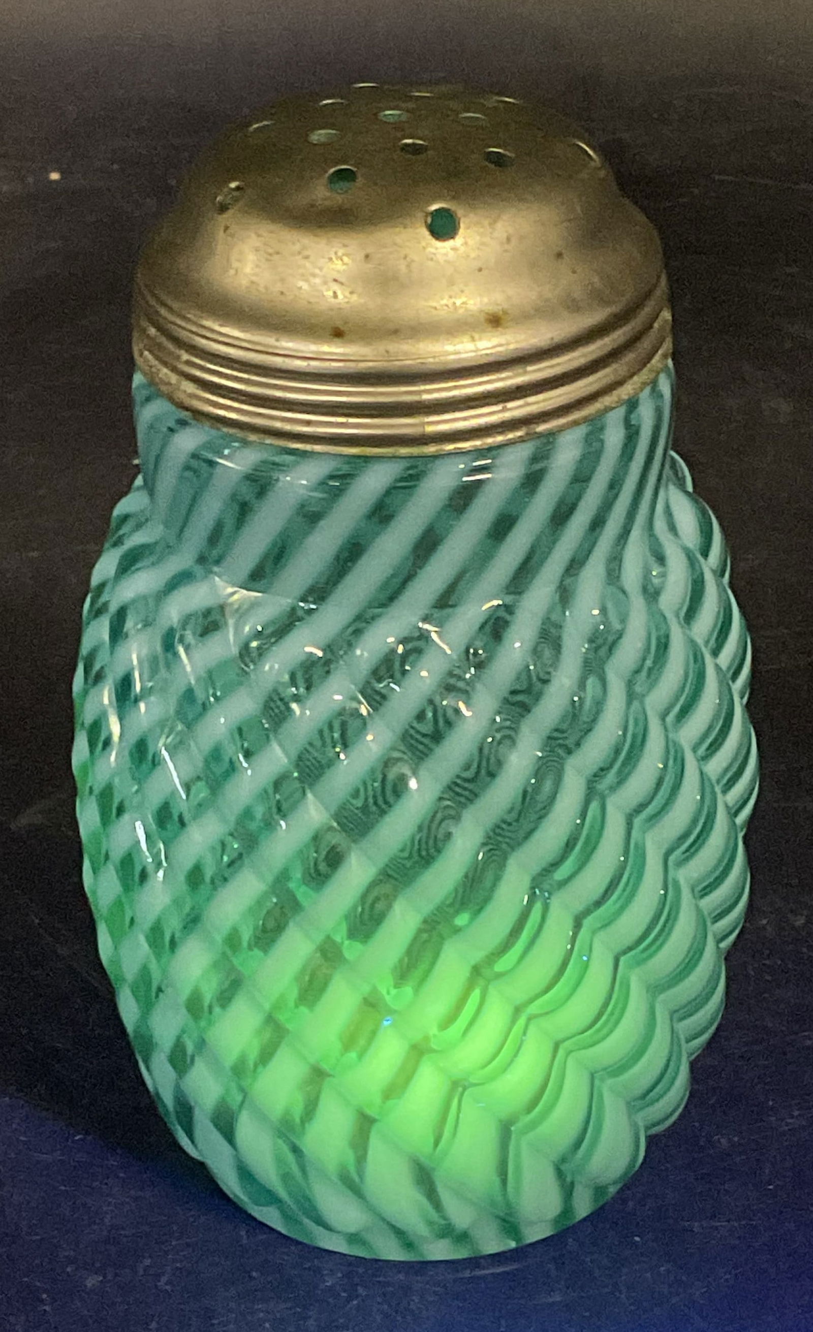 Antique Blue Opalescent Uranium Glass Shaker: Antique uranium glass opalescent blue swirl pattern sugar shaker. Glass is UV light reactive. Measures approx. 2.75 x 4.75 inches. Some scratching and patina. Antiques, collectibles, antique sugar sha