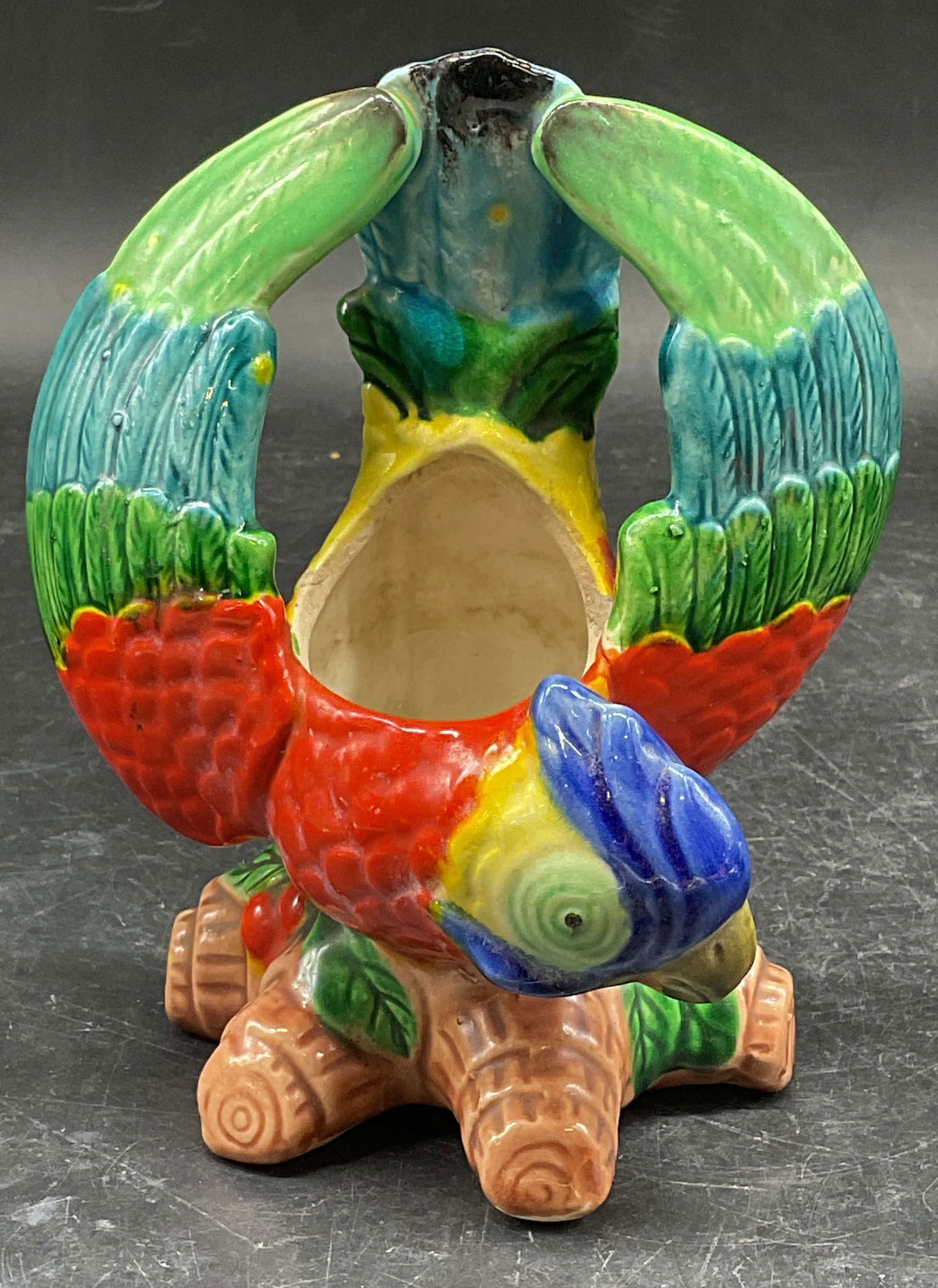 Signed Vintage Ceramic Parrot Planter: Vintage signed ceramic parrot bird motif planter. Hand painted green, red, blue, yellow. Signed illegibly on underside. Measures approx. 4.5 x 2.5 x 6 inches. Some scratching and crazing. Parrot plant