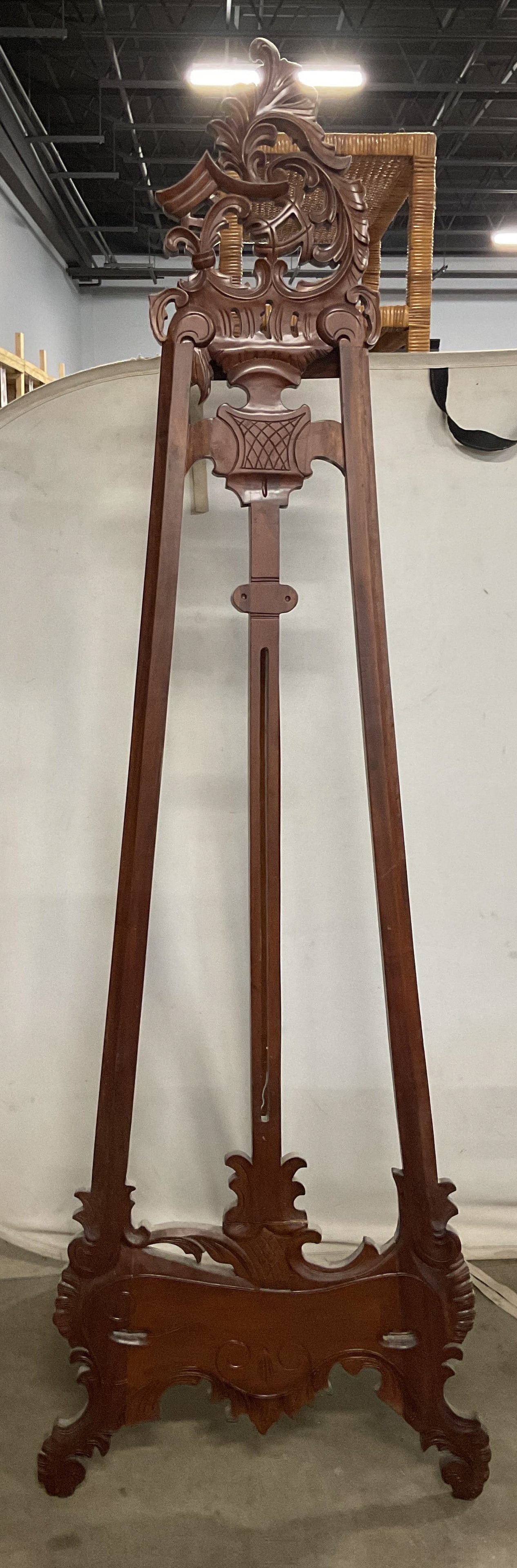 Vintage Ornate Carved Wood Easel 84 Inches Tall: Vintage, possibly antique, Victorian style ornate carved wood easel display. Measures approx. 26 x 84 inches. Some wear including scratching, splitting, and chips. Victorian style easel, easel display