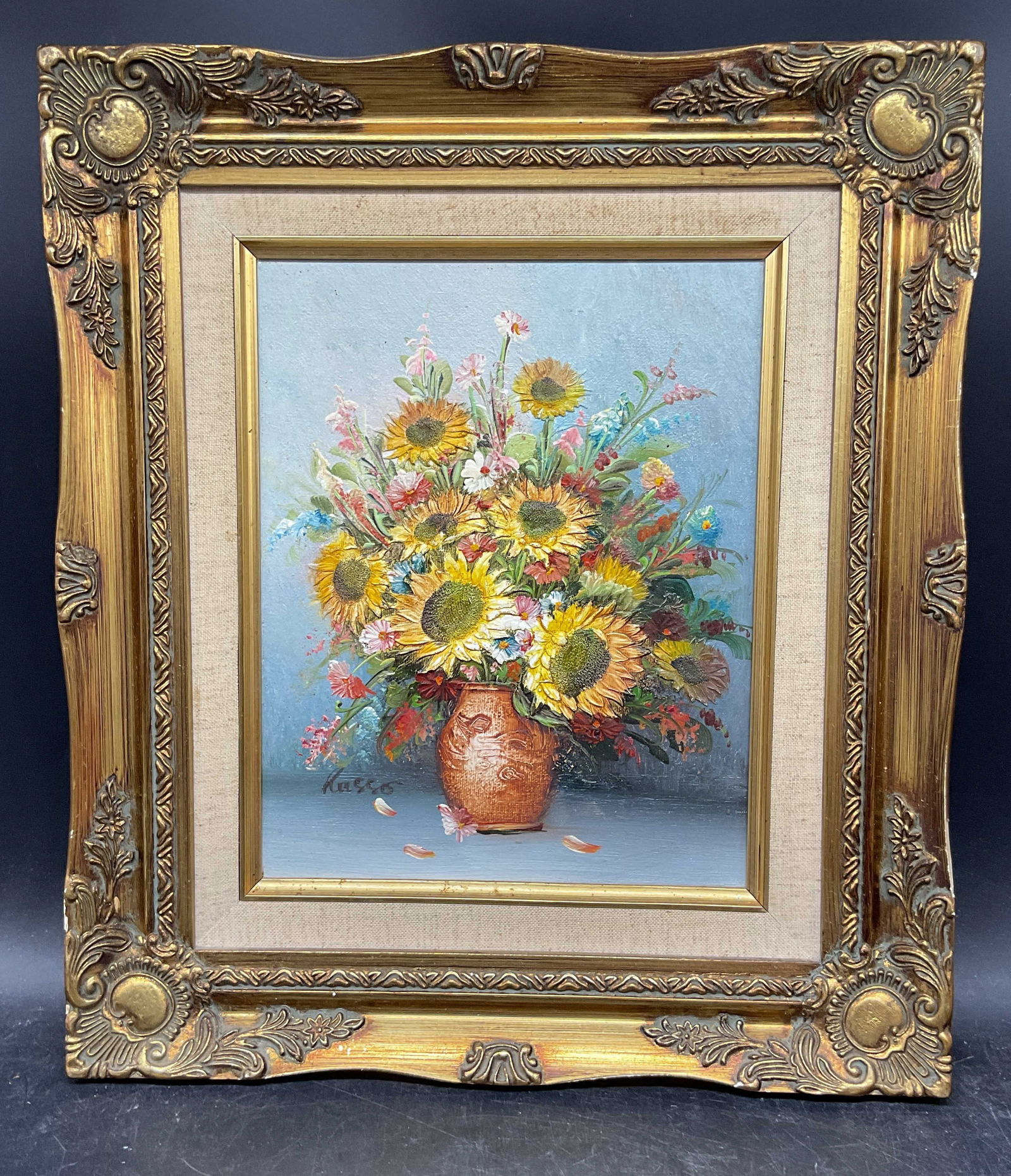 Signed Russo Still Life Sunflowers Oil Painting: Framed oil on board painting. Signed lower left, Russo. Still life with vase of sunflowers. Ornate gilt wood frame. Not examined out of frame. Frame measures approx. 13.25 x 15.25 inches. Some wear co