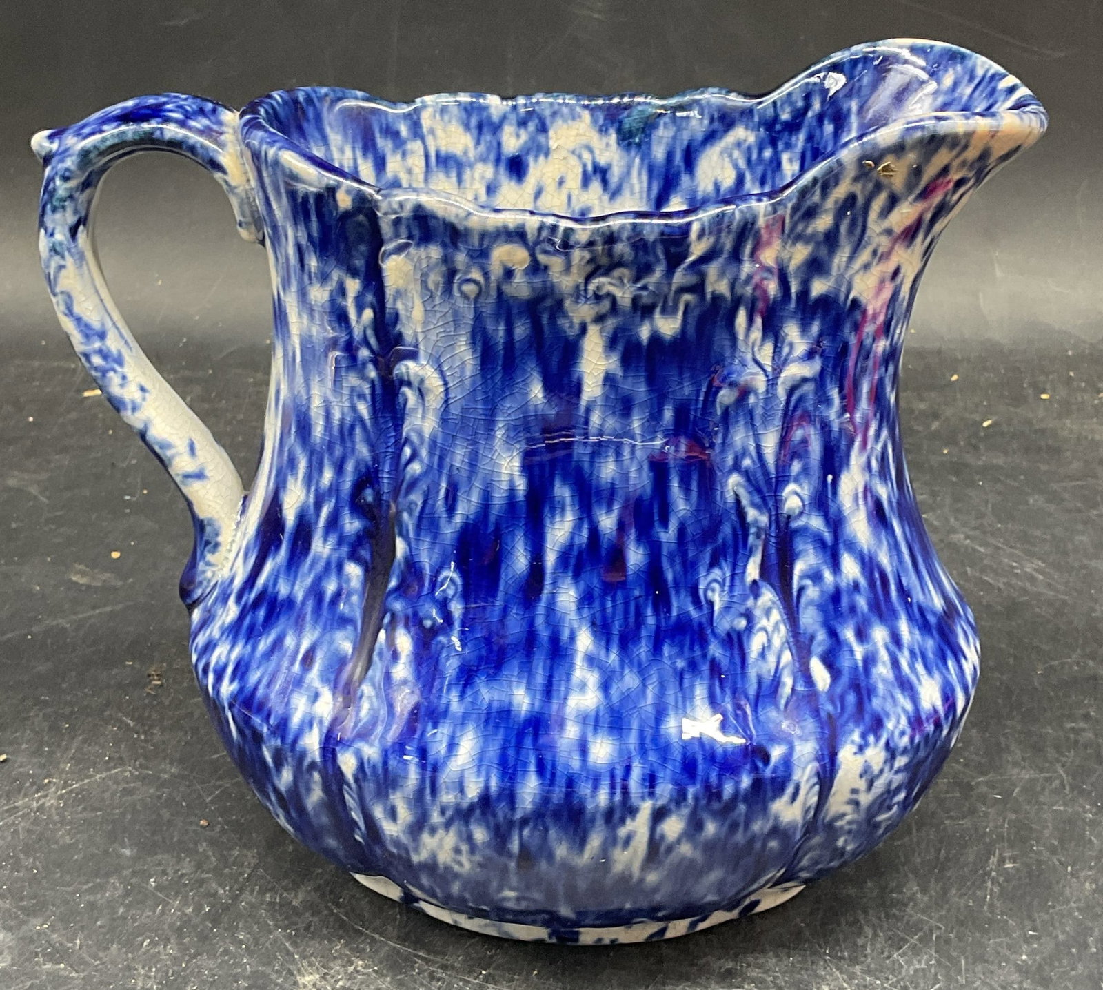 Antique Blue & White Spongeware Pitcher: Antique ceramic pitcher, blue and white Spongeware. Measures approx. 7 x 4.25 x 6.25 inches. Wear including crazing and scratching. Spongeware pitcher, antique spongeware, antiques, collectibles, blue