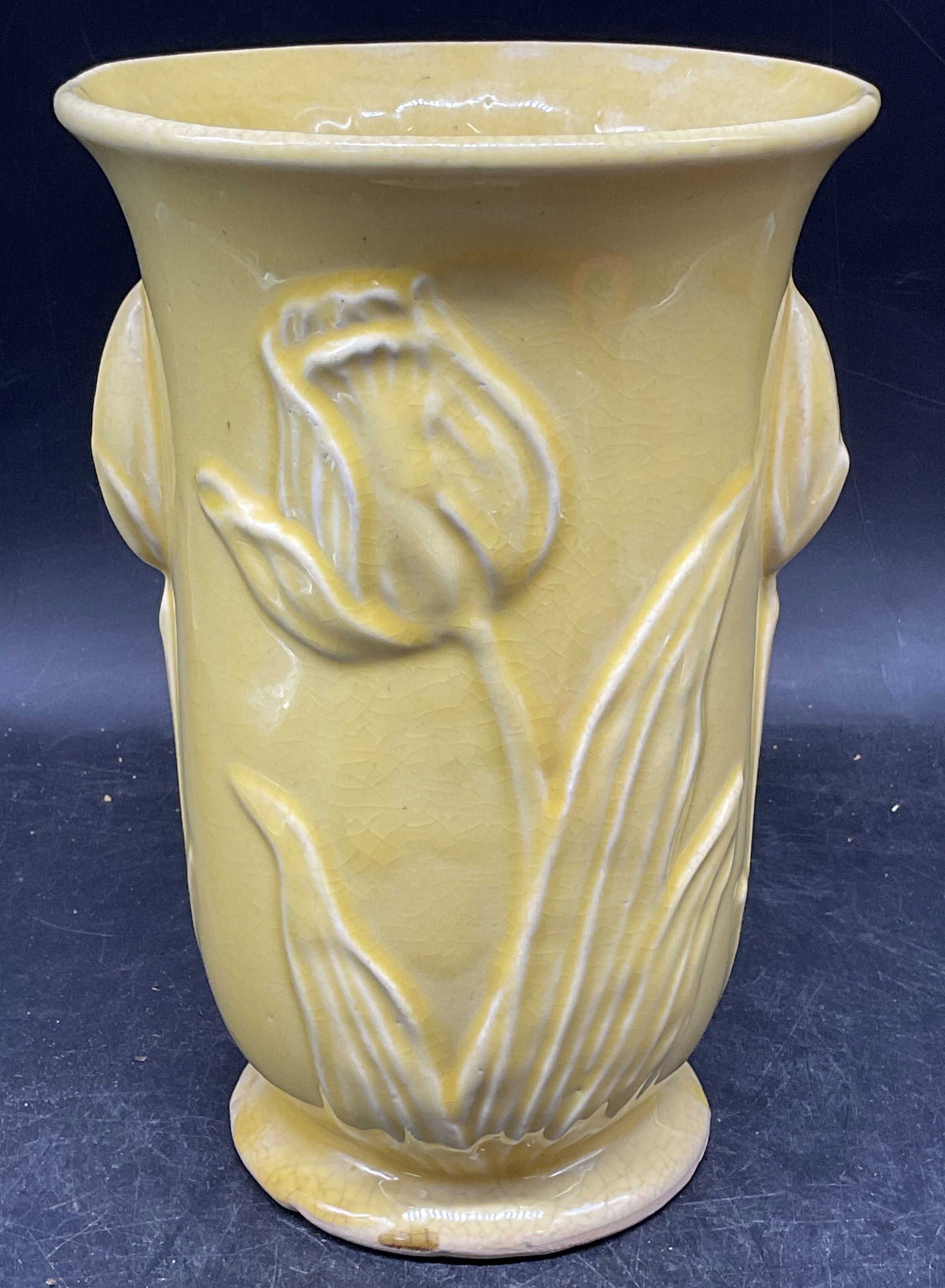 1940s McCoy Pottery Yellow Tulip Vase USA: Vintage circa 1940s McCoy pottery vase, raised tulip design in yellow. Made in USA. Measures approx. 6 x 8 inches. Wear including crazing and small chips. McCoy vase, tulip vase, yellow vase, collecti