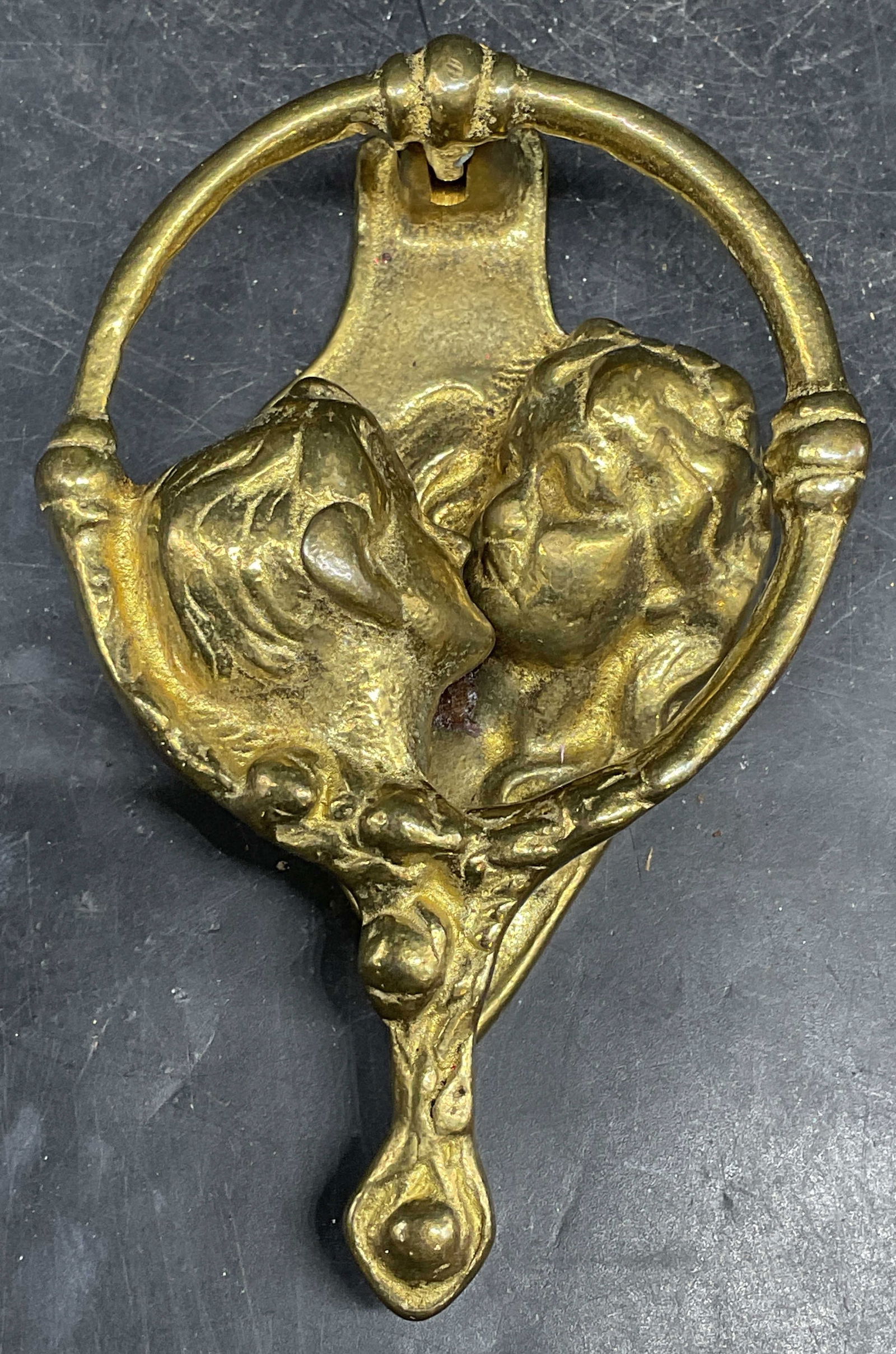 Ritter & Son Brass Lovers Door Knocker: Signed Ritter & Son cast brass door knocker. Lovers or Romeo and Juliet design. Measures approx. 3 x 4.75 inches. Some scratching. Lovers door knocker, Romeo and Juliet door knocker, brass door knocke