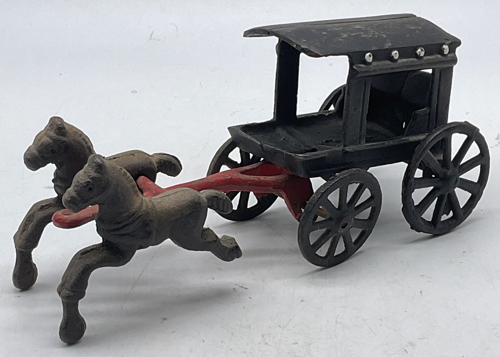 Antique Iron Horse Drawn Covered Wagon Toy: Antique cast iron toy. Covered wagon drawn by two horses. Measures approx. 8 x 2.5 x 3.5 inches. Wear including losses to paint, patina, scratching. Antique, collectibles, antique toy, iron wagon, wag
