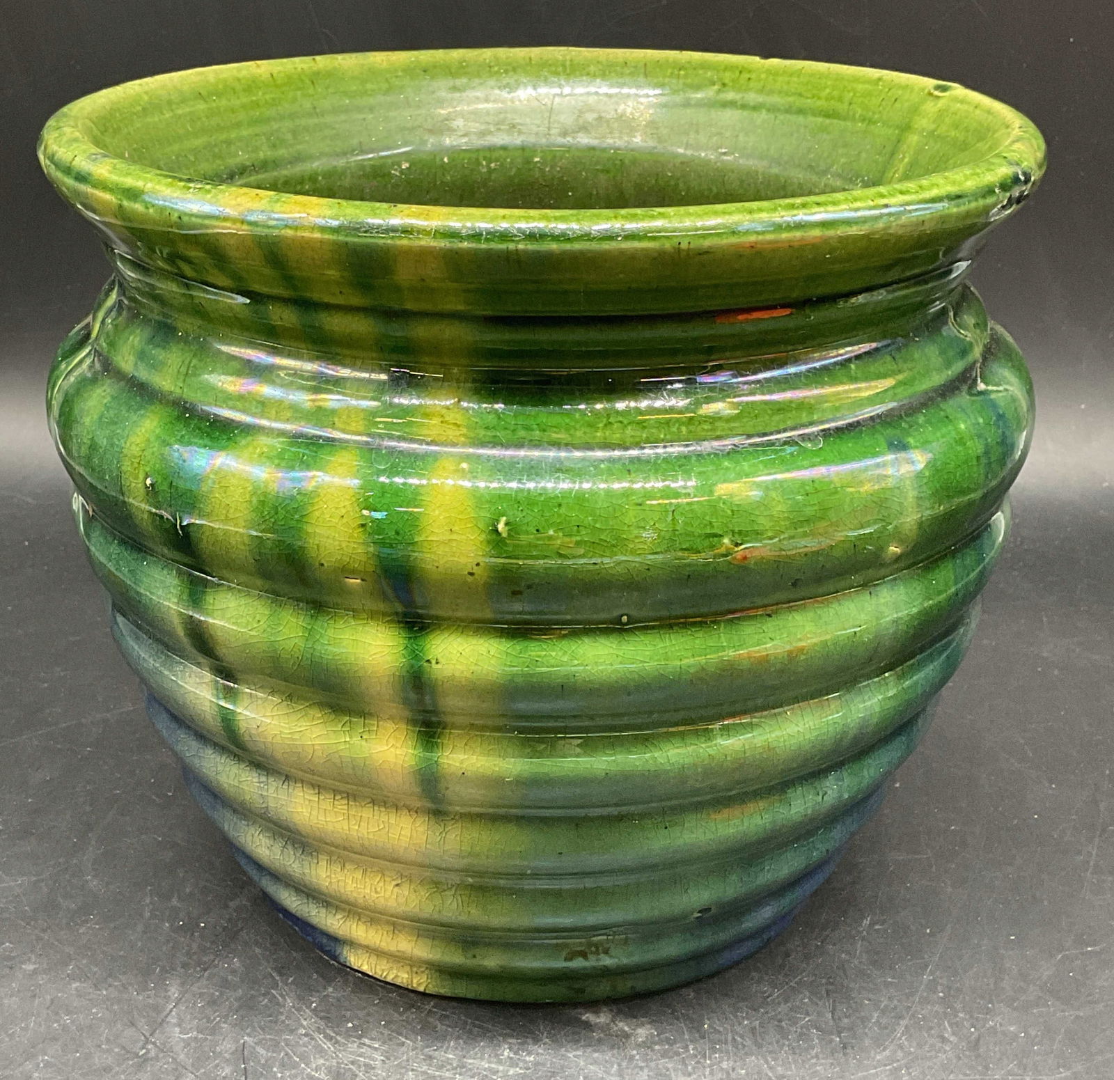 Vintage Green Ribbed Drip Glaze Pottery Planter: Vintage pottery planter. Ribbed design with green and blue drip glaze. Measures approx. 8.5 x 7.25 inches. Wear including crazing and scratching. Pottery planter, green planter, drip glaze planter, ho