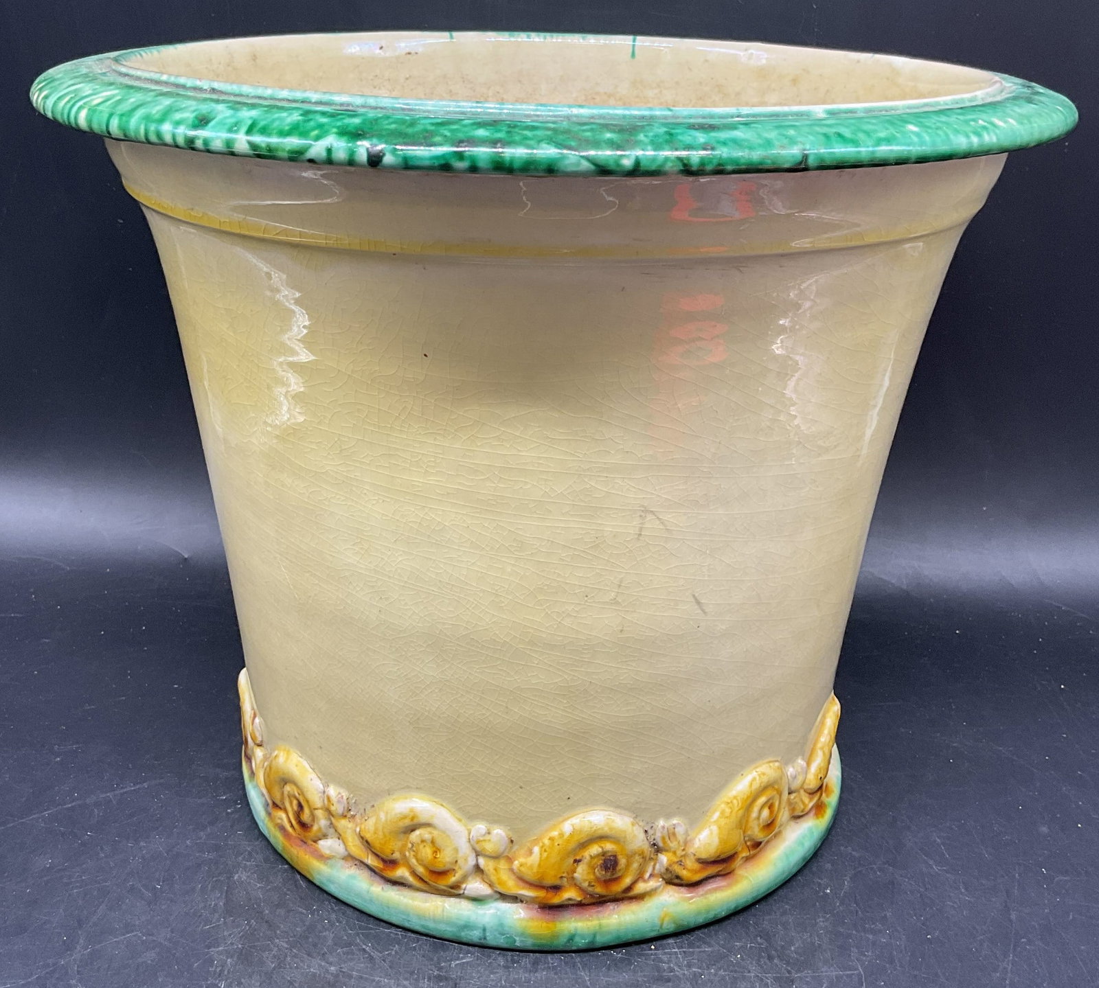 Vintage Yellow Green Snail Pottery Planter: Vintage pottery planter. Hand glazed yellow and green with snail motif border on base. Planter has weight. Measures approx. 11 x 9 inches. Wear including crazing and small chips. Pottery planter, snai
