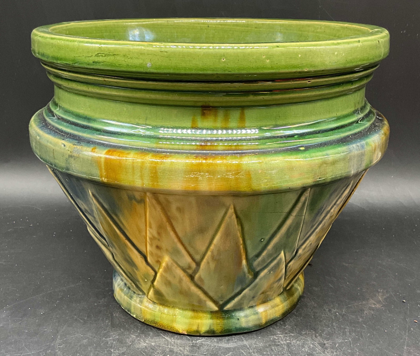 Antique McCoy Pottery Art Deco Jardiniere Planter: Antique McCoy pottery art deco jardiniere planter. Geometric design. Hand glazed green. Measures approx. 10.5 x 8.5 inches. No signature or marking. Wear including hairlines, small chips, scratching.