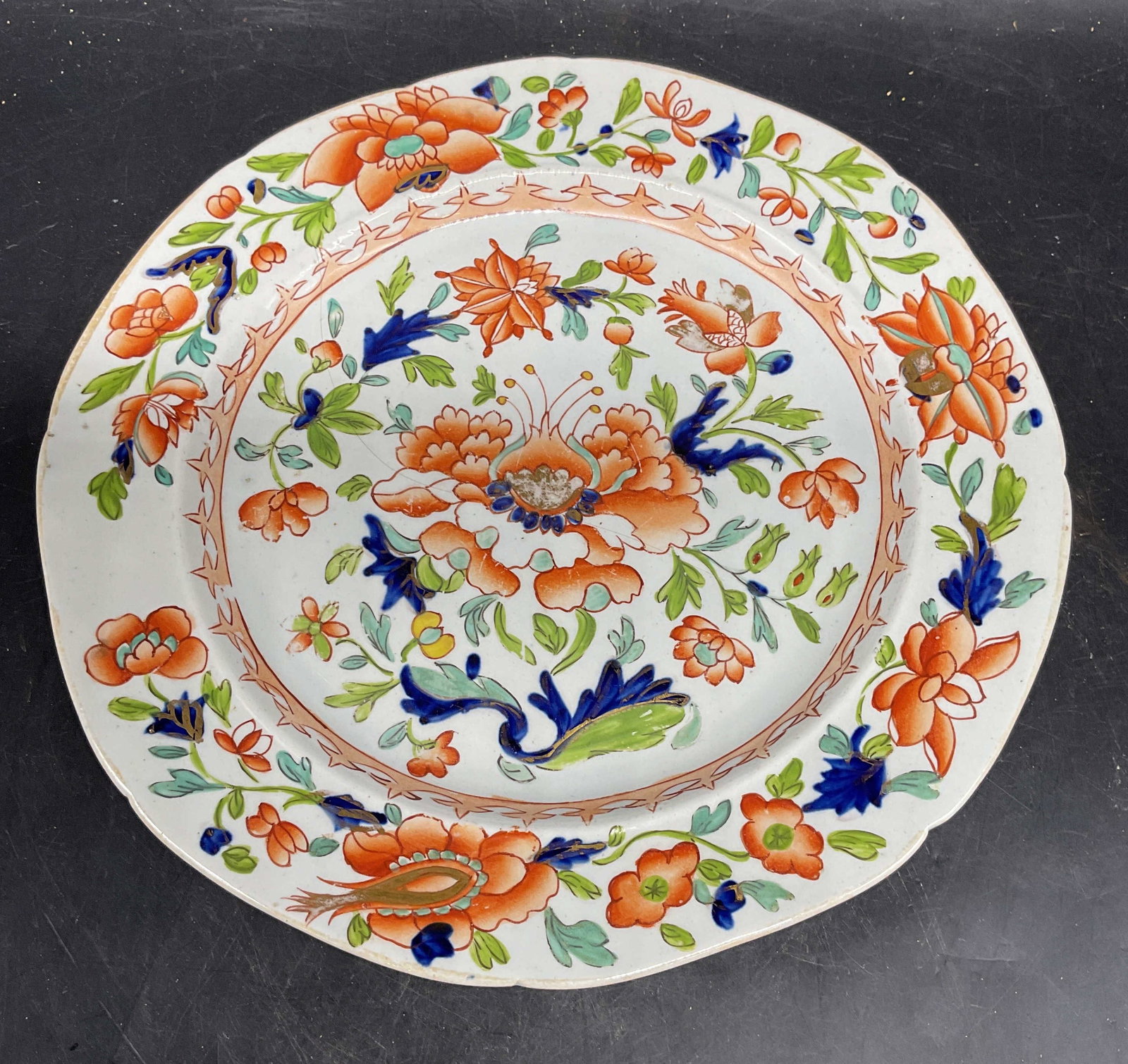 Antique Masons Ironstone Chinoiserie Plate: Antique Masons ironstone China plate. Hand painted chinoiserie pattern. Intricate floral design. Red, blue, and green. Signed. Made in England. Measures approx. 9.25 inches wide. Wear including loss t