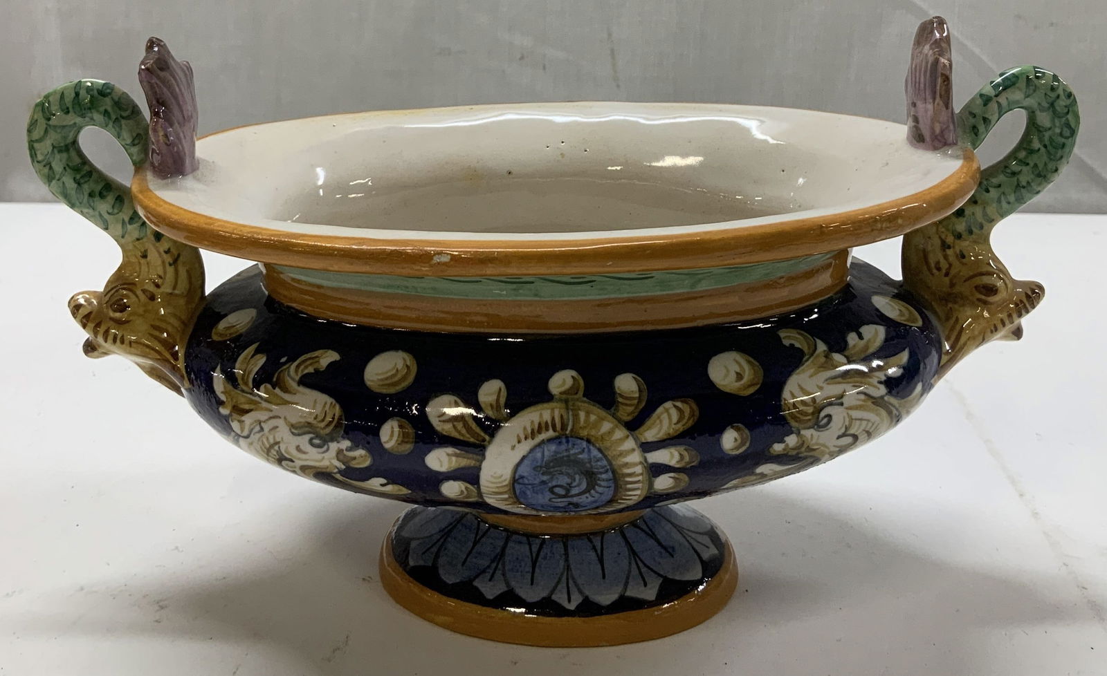 Vtg Hand Painted Footed Compote ITALY: Vintage ceramic footed compote features hand painted fish like motifs & geometric accents. Stylized handles. Orange, blue, green, purple, white. Signed & marked on underside. Reads, ITALY. Surface wea