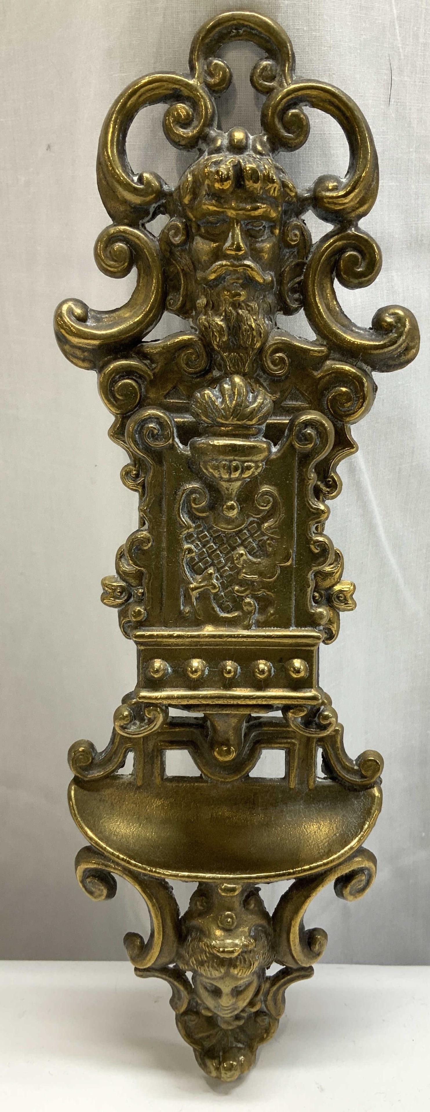 Antique Brass Ornate Wall Match Holder: Antique, possible vintage. Wall match holder features ornate scroll designs. Figural head motifs of a man & a woman. No visible signature or markings. Surface wear consistent to age, use & exposure. M