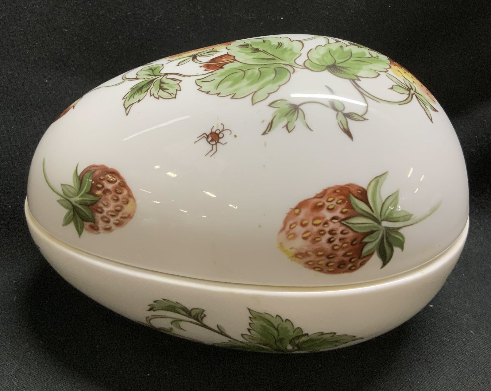 Vtg Coalport Strawberry Trinket Box ENGLAND: Vintage egg shaped trinket box features strawberry motifs on lid & body. Bone china material. Signed & marked on underside. Reads, BONE CHINA COALPORT. MADE IN ENGLAND. EST 1750. STRAWBERRY. Surface w