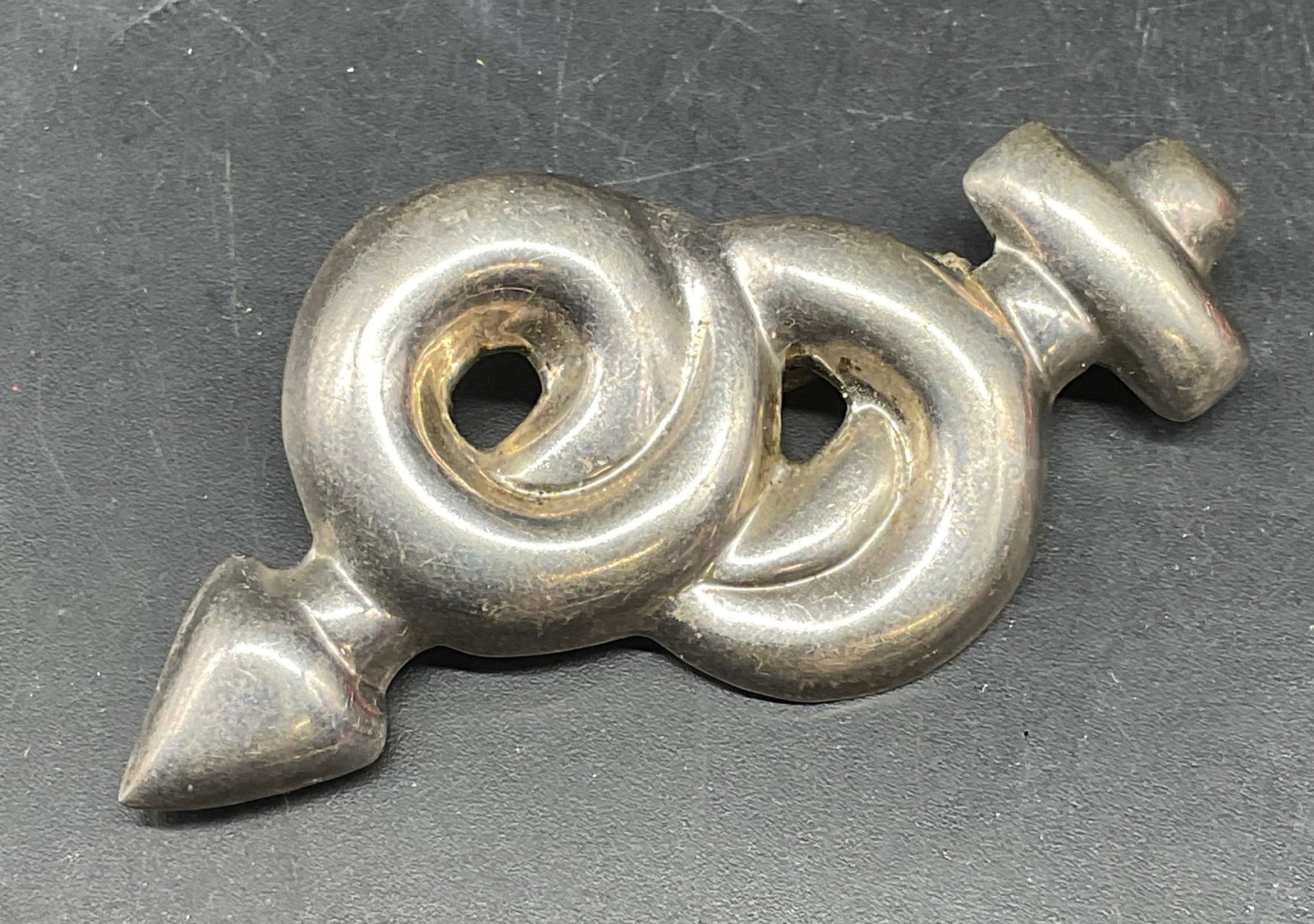 Sterling Silver Spiral Arrow Brooch, Mexico: Vintage sterling silver spiral arrow motif brooch. Marked sterling. Made in Mexico. Measures approx. 2.5 x 1.25 inches. Total weight 11.9 grams. Some scratching. Jewelry, estate jewelry, fine